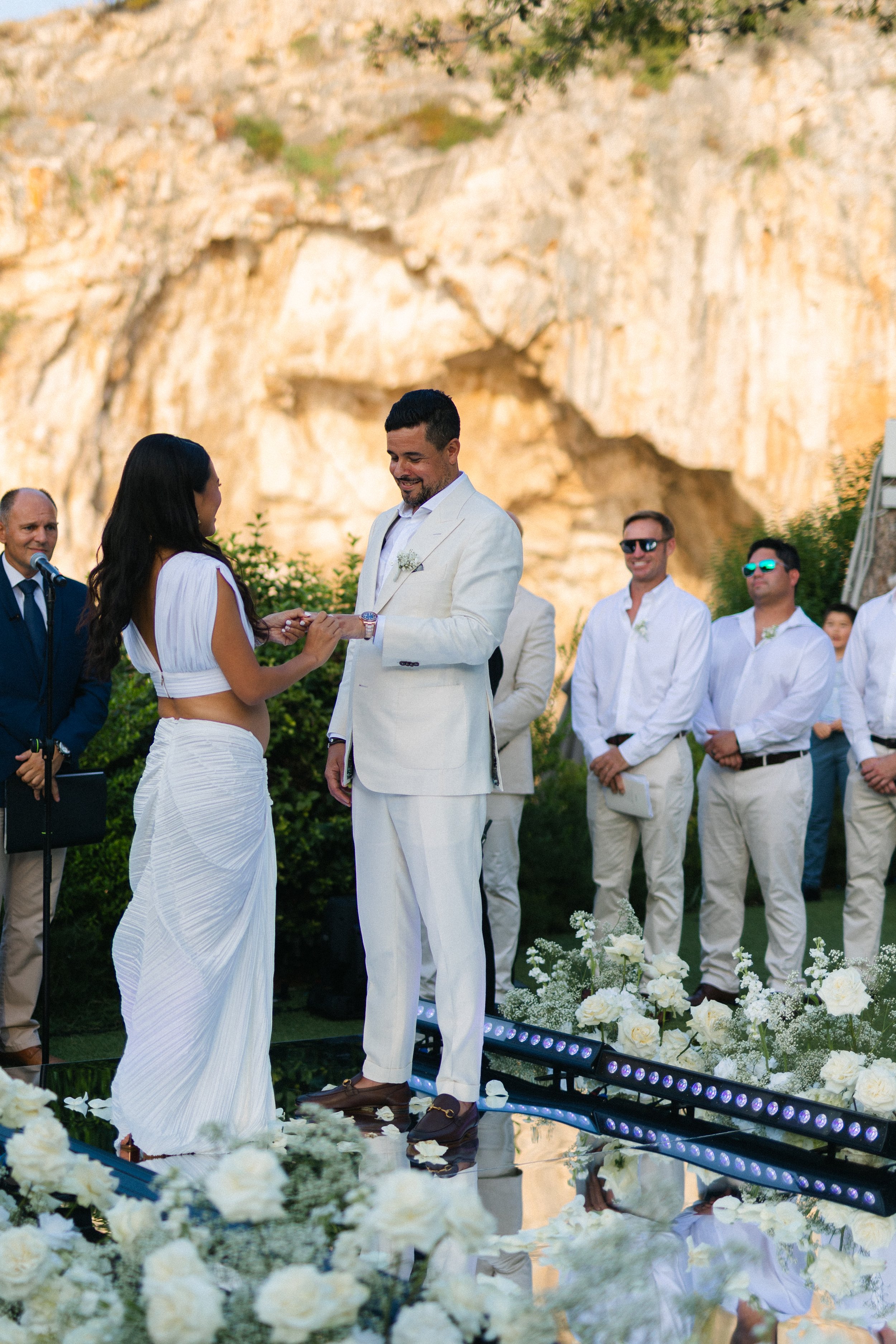 Emotional ceremony moment Lake Vouliagmeni Greece wedding