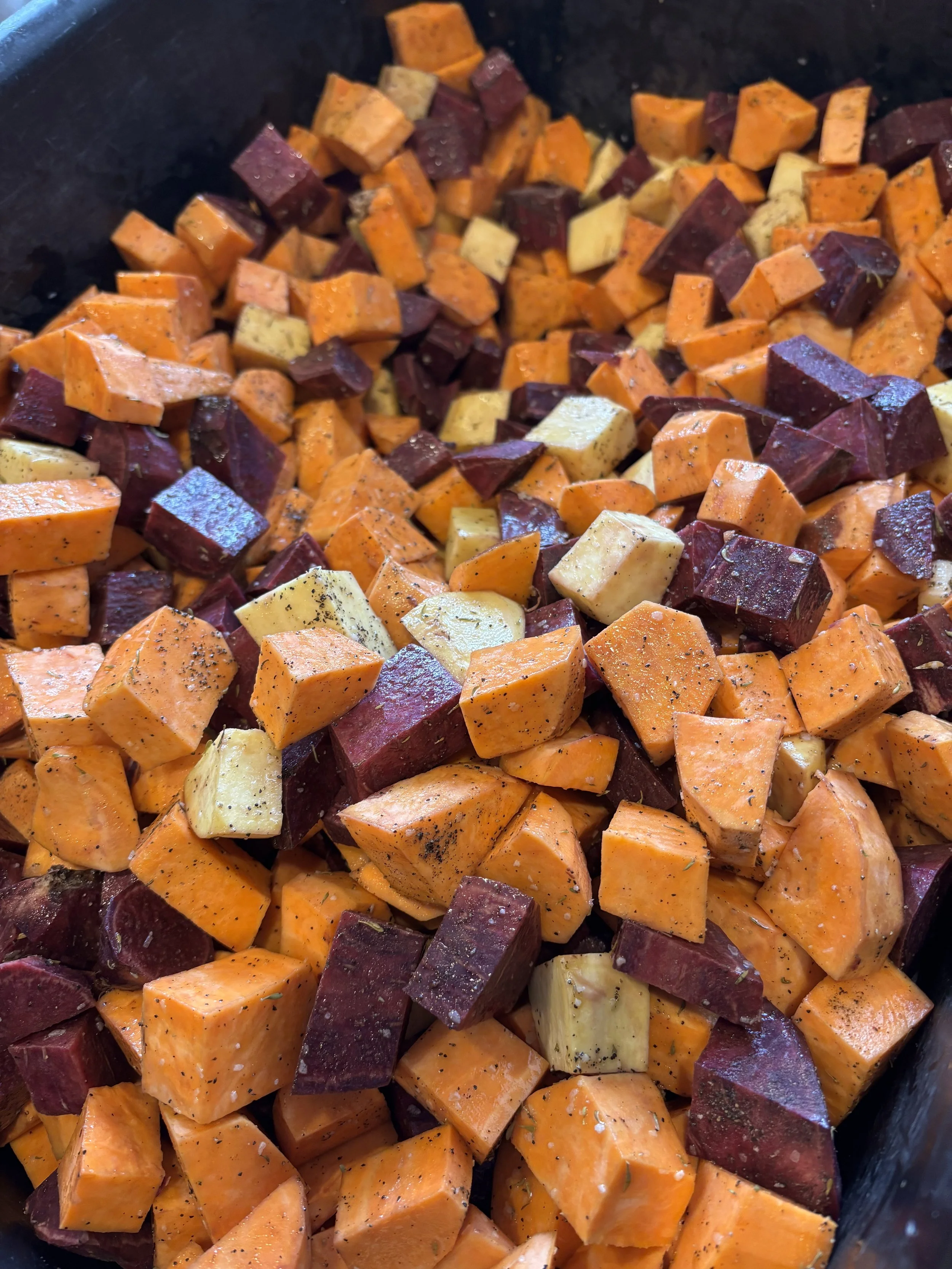 Local sweet potatoes before hitting the oven!