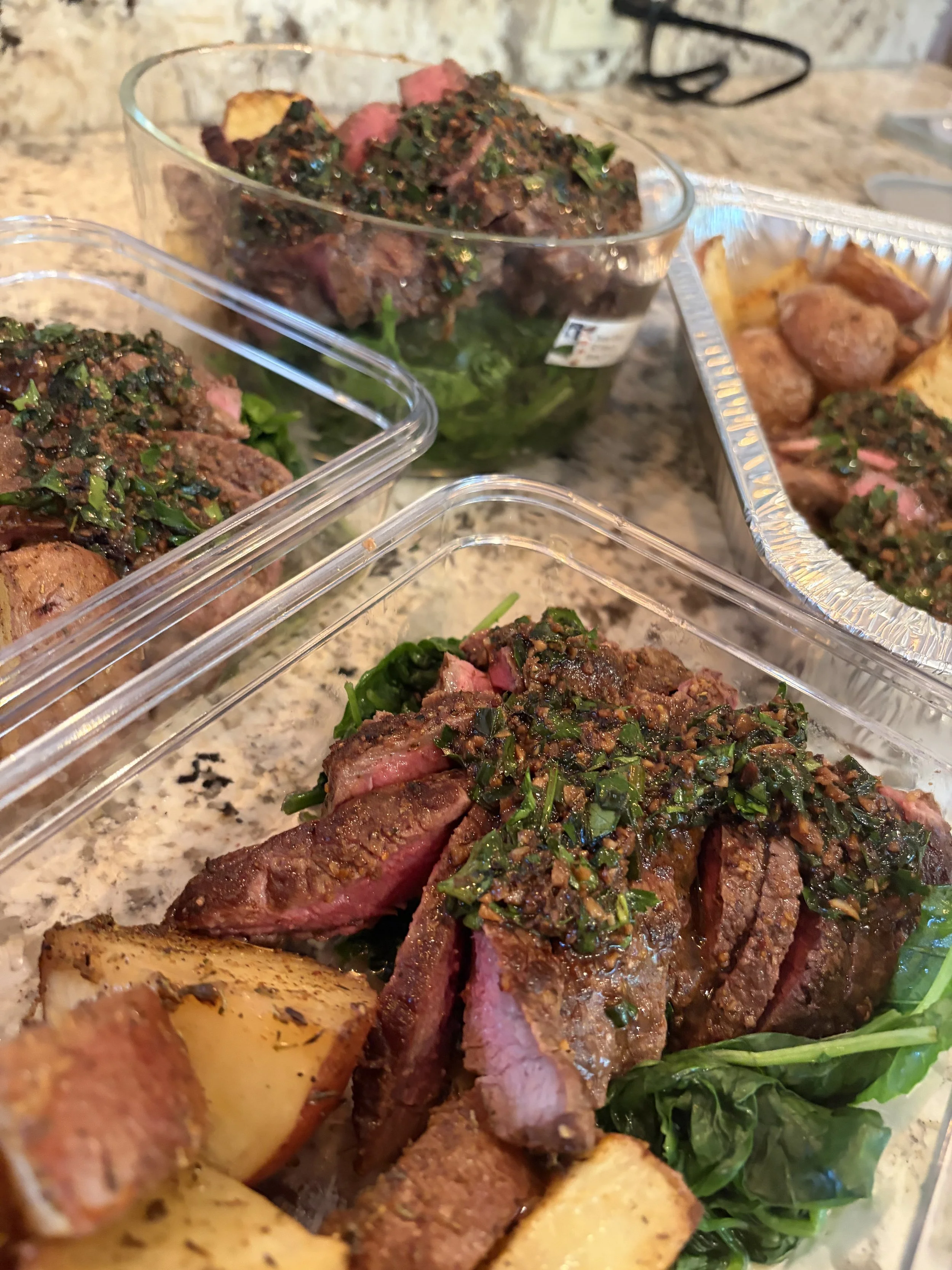 Garlic Butter round steak, sauteed greens and roasted potatoes