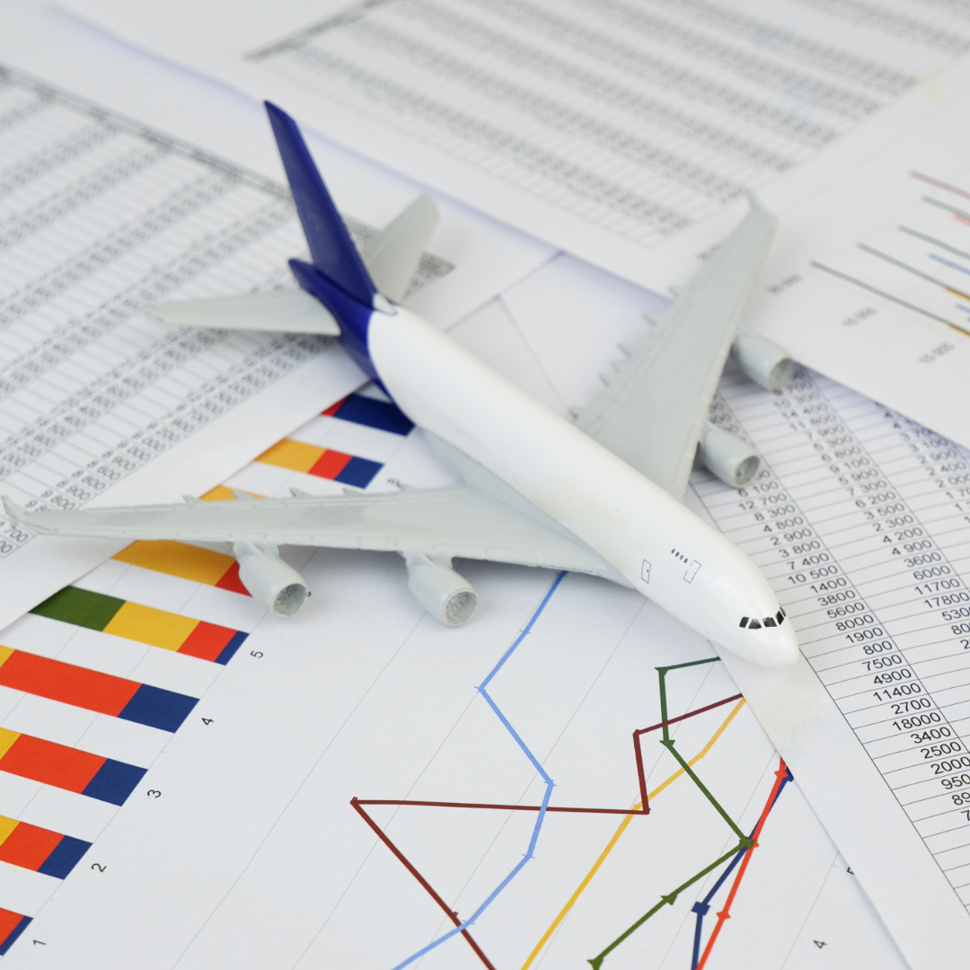 A professional grade model of a modern commercial jet airliner over calculations and engineering graphs.