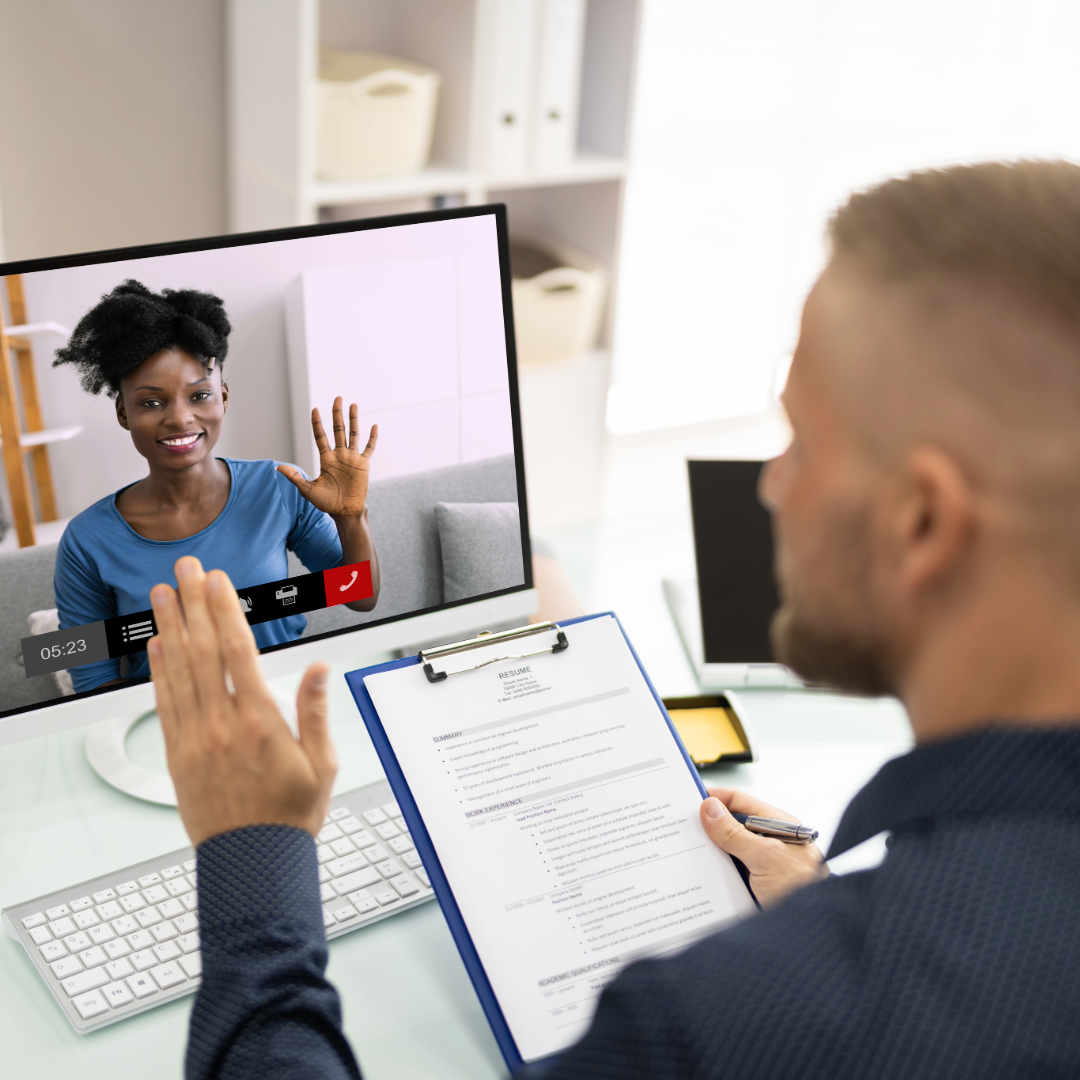 A computer screen is visible during a video call. It is an online interview session.
