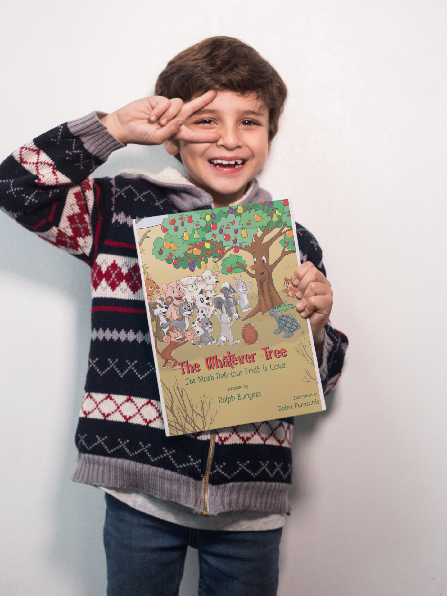 happy-boy-doing-the-peace-sign-holding-a-big-book-mockup-a19220.png