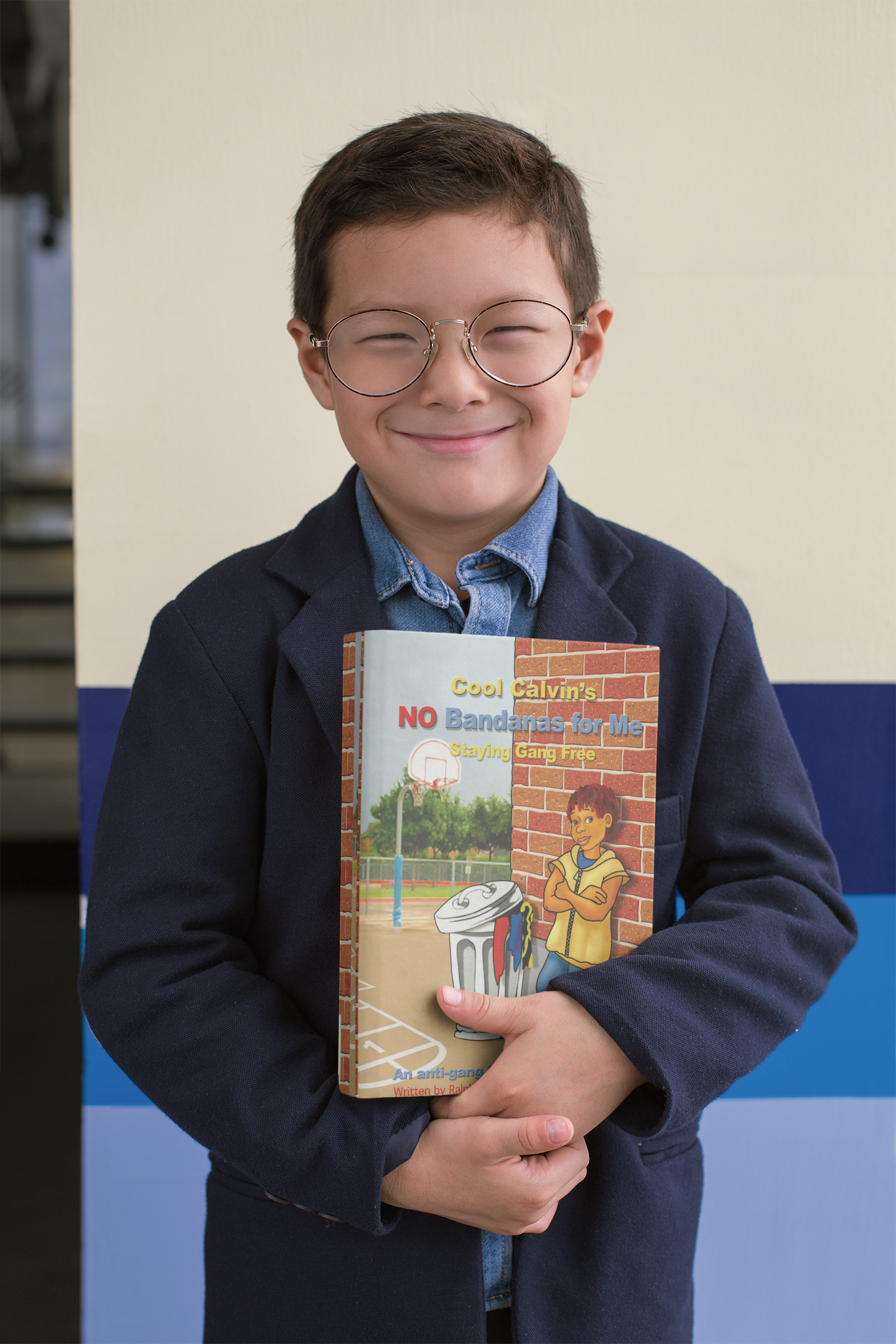 mockup-of-a-young-smiling-boy-holding-a-book-to-his-chest-23728.png