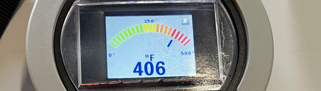 Digital display showing 406°F and a gauge with colored zones from green to red.