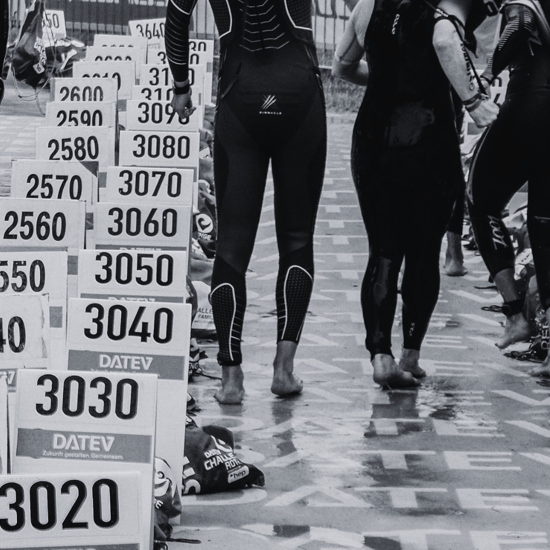 Two triathletes running into the transition area of Challenge Roth.