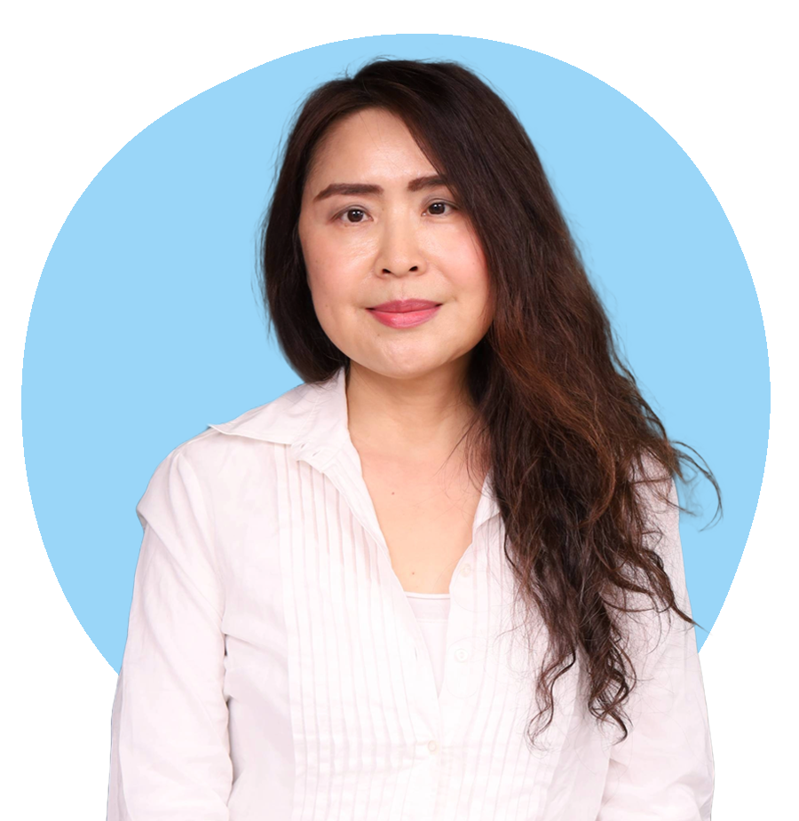 Professional headshot of Nicole Meng, therapist at Oasis of Hope, wearing a white blouse against a light blue background.