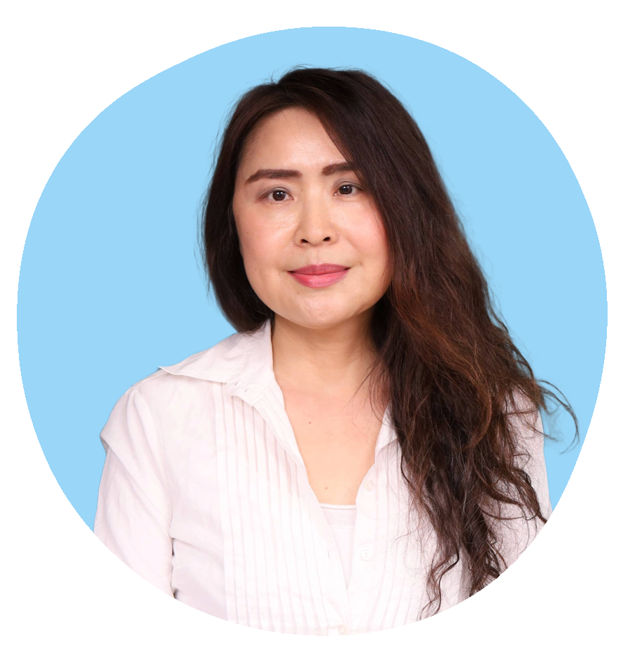 Studio portrait of Nicole Meng, therapist at Oasis of Hope, wearing a white blouse with a soft blue background.