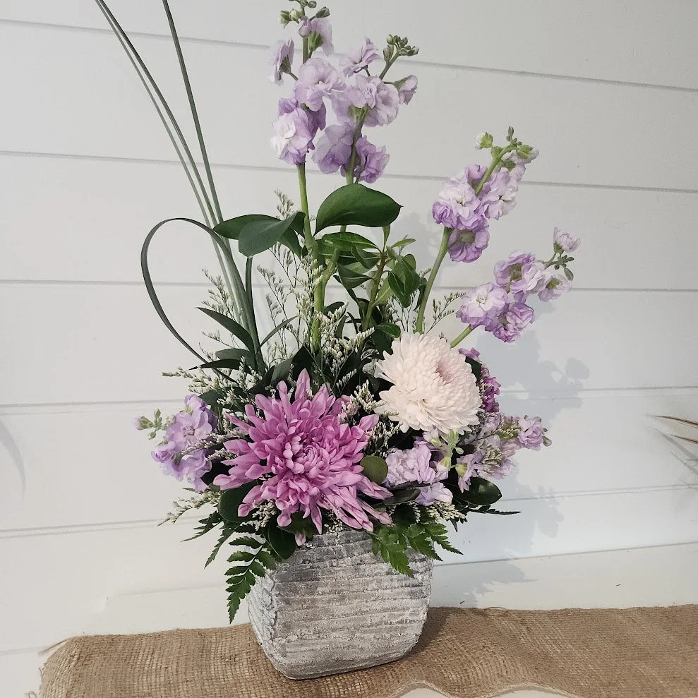 Mauve is marvelous Bouquet in stone planter.jpg 2.jpg