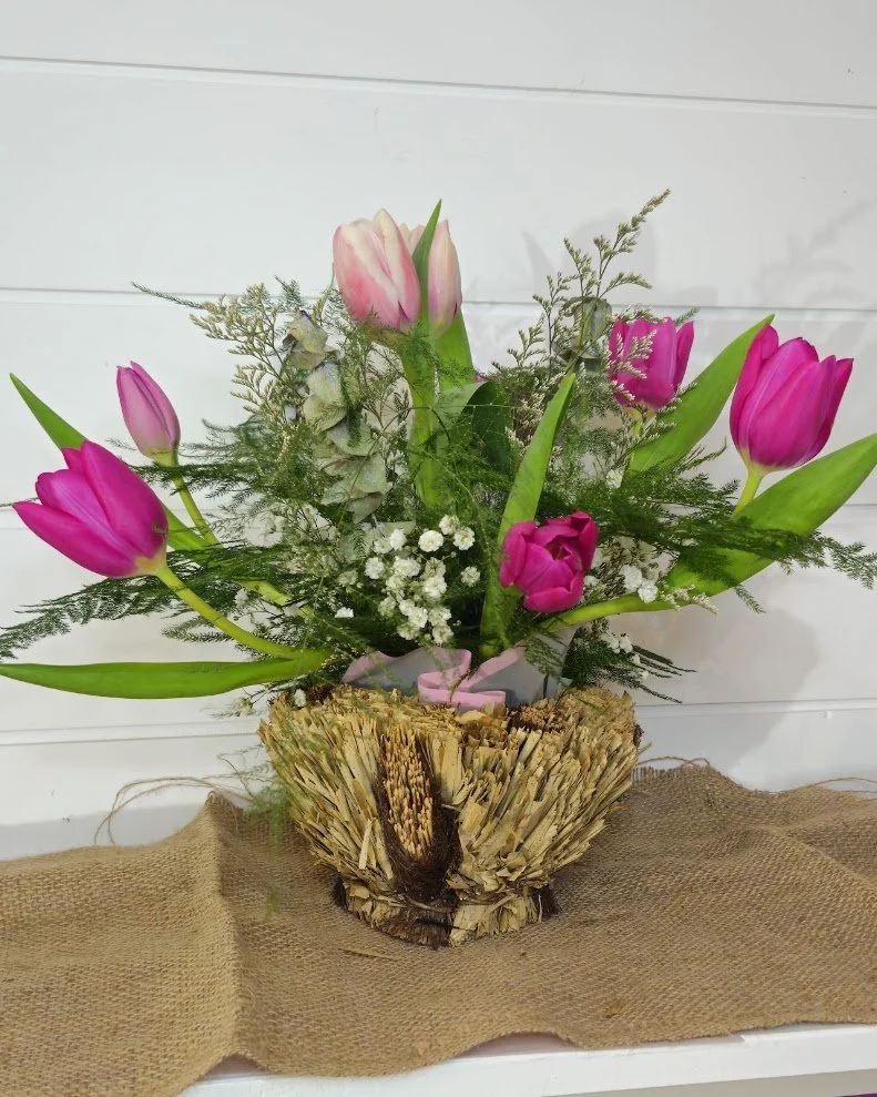 tulips in straw.jpg