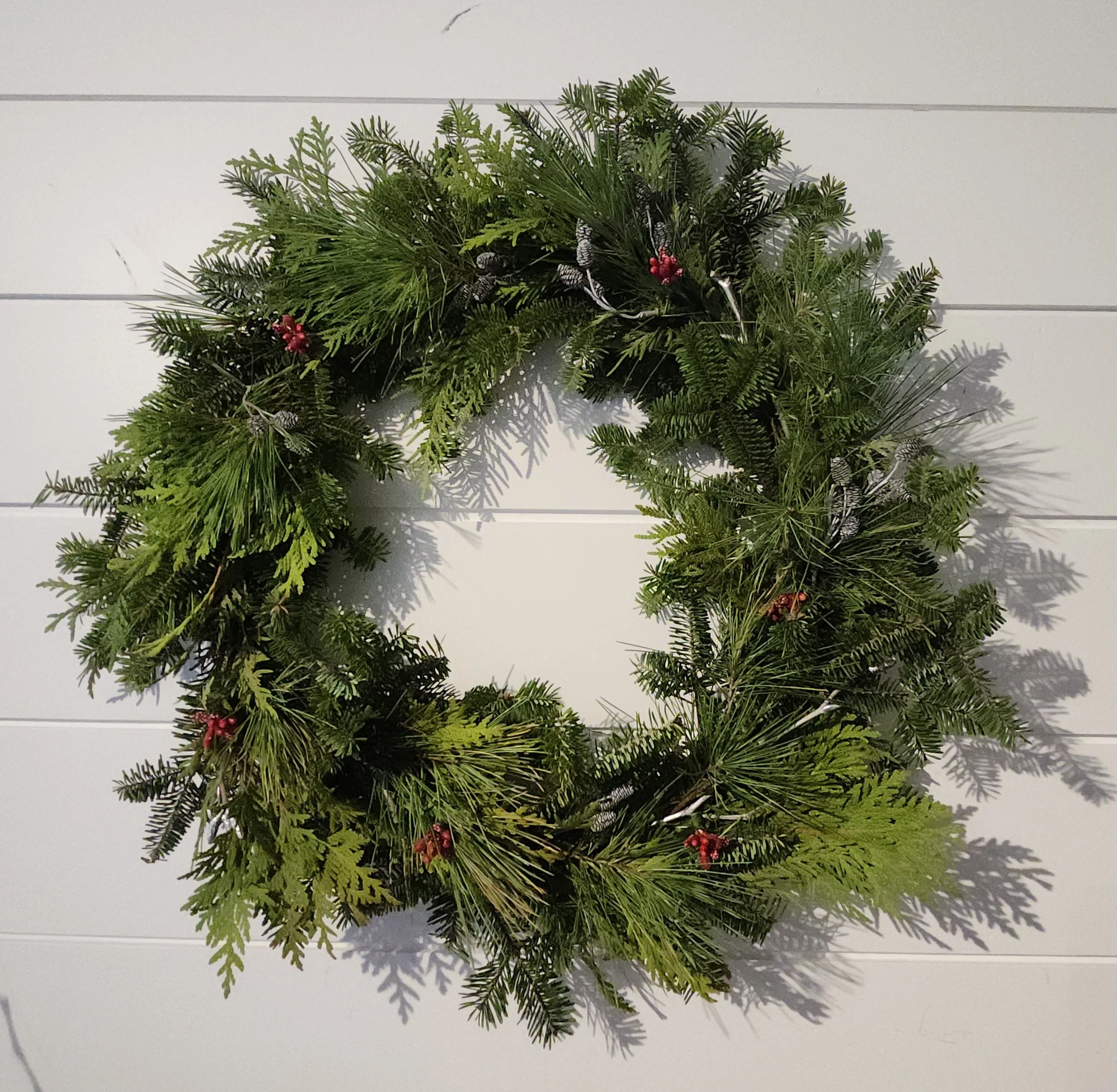 wreath small cones and berries no bow.jpg