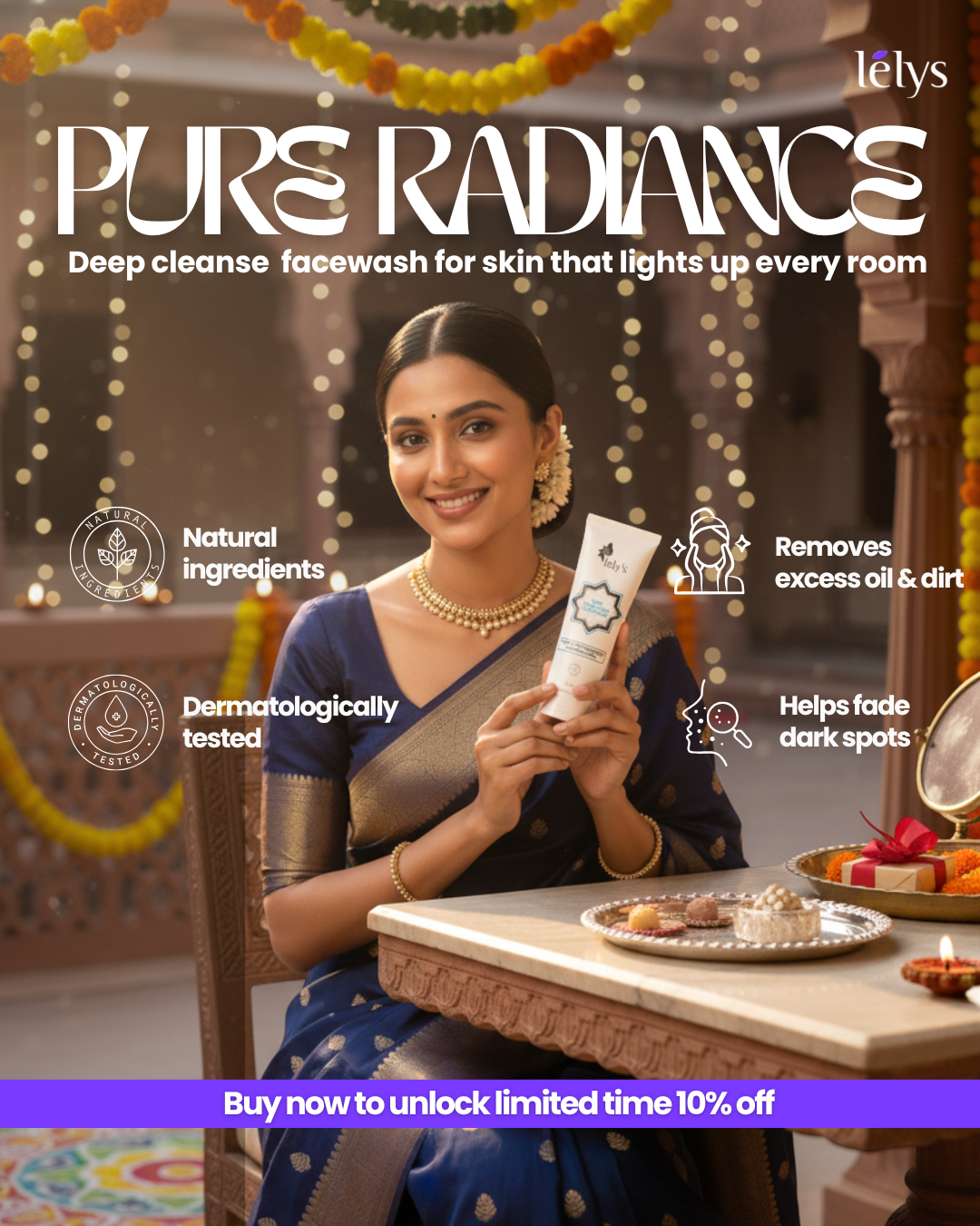 A woman dressed in a traditional Indian saree, sitting at a decorated table with marigold flower garlands and lights in the background, holding a tube of skincare product and smiling.