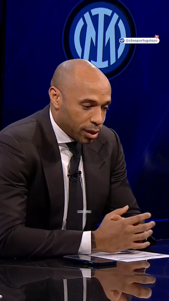 A looping gif in portrait showing a clip of Thierry Henry talking to Micah Richards on a CBS show called UCL Today. The in video caption reads 'Thierry is astonished by Yamal's talent'
