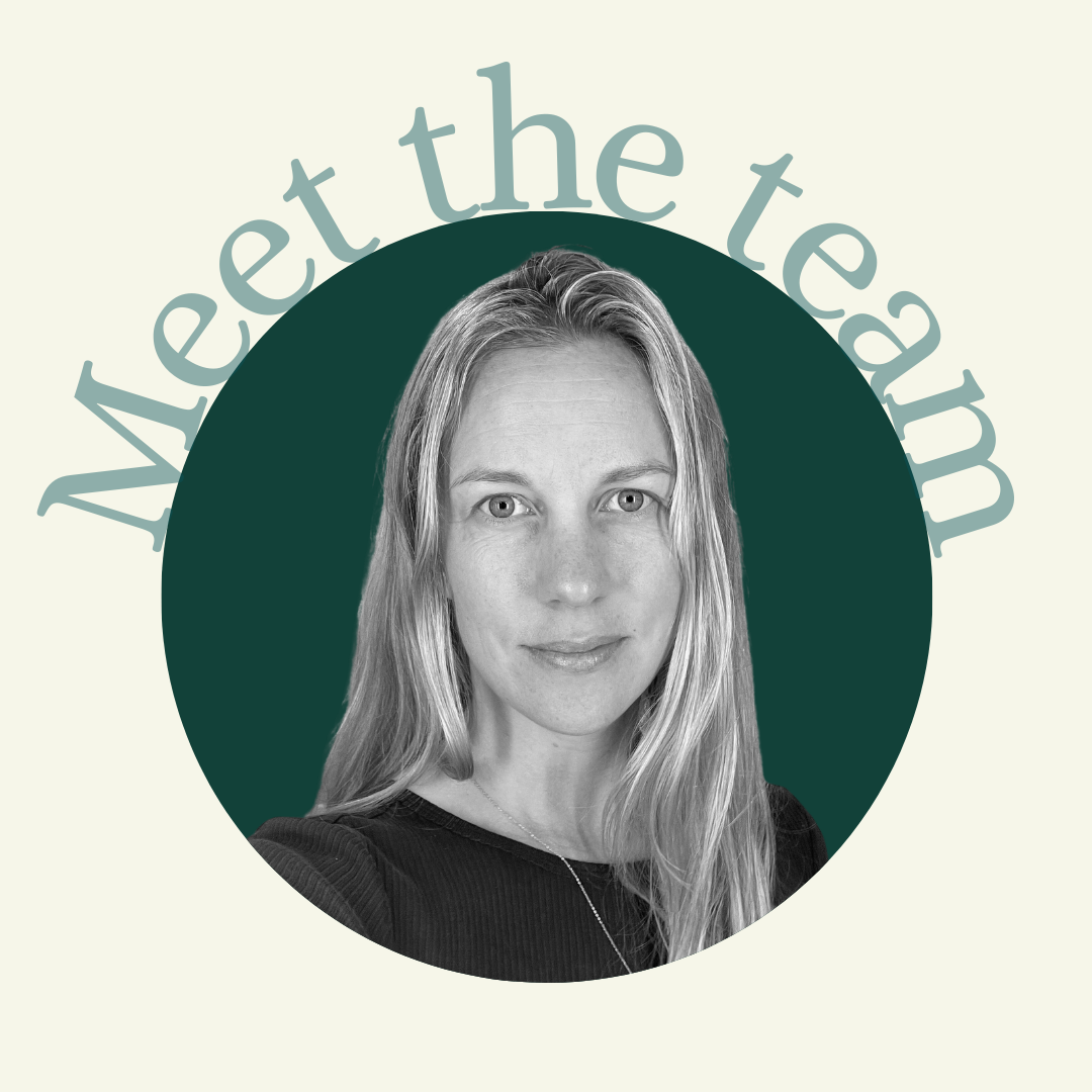 Black and white portrait of a woman with long blonde hair, set against a dark green circle background. Text in light gray reading "Wee the team" is curved around the top of the circle.