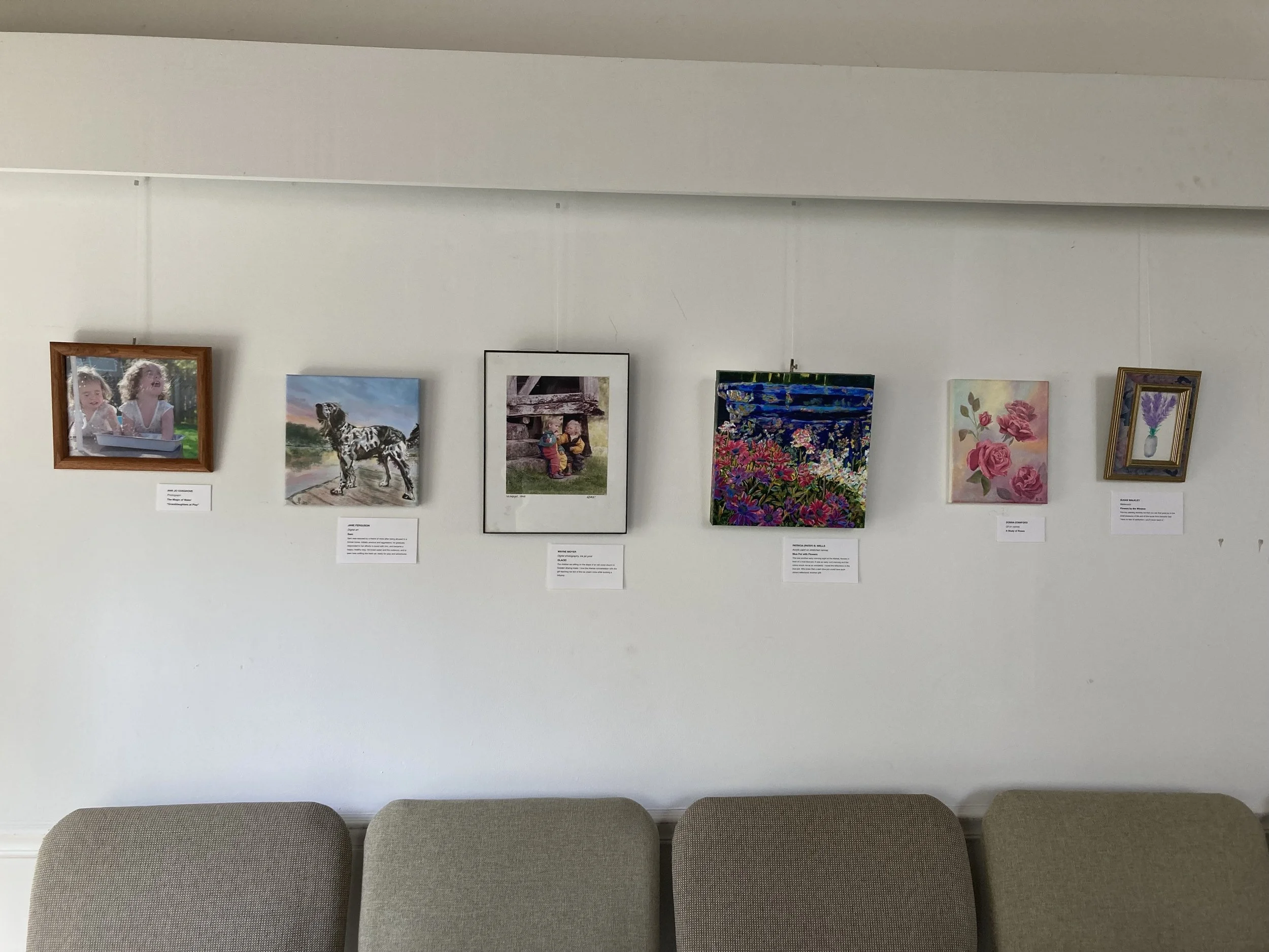 Art Show 2025 Paintings on Back Wall.jpg
