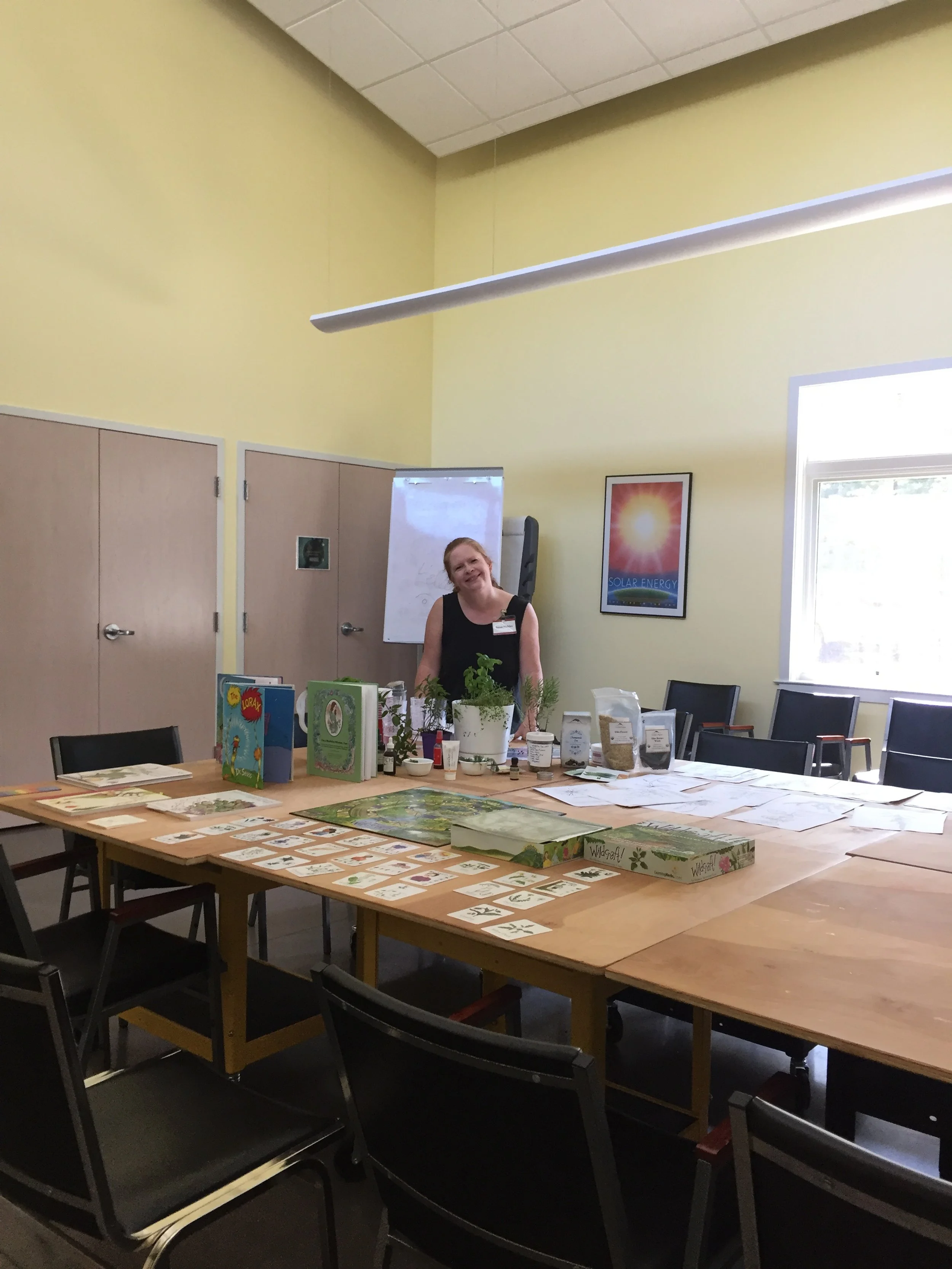 sue with plant herb day setup 1.JPG