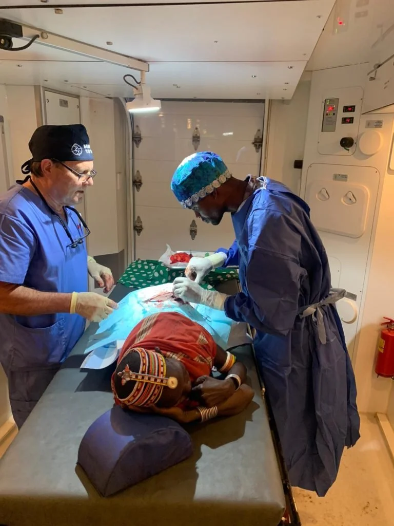 Volunteer Dan Olsen teaching a Kenyan trainee in the M2H Mobile Surgical Units.