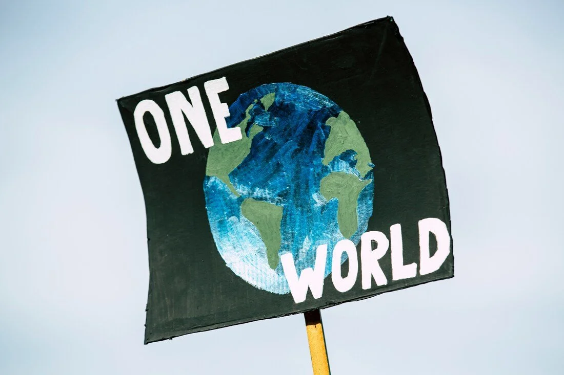 one world earth day sign
