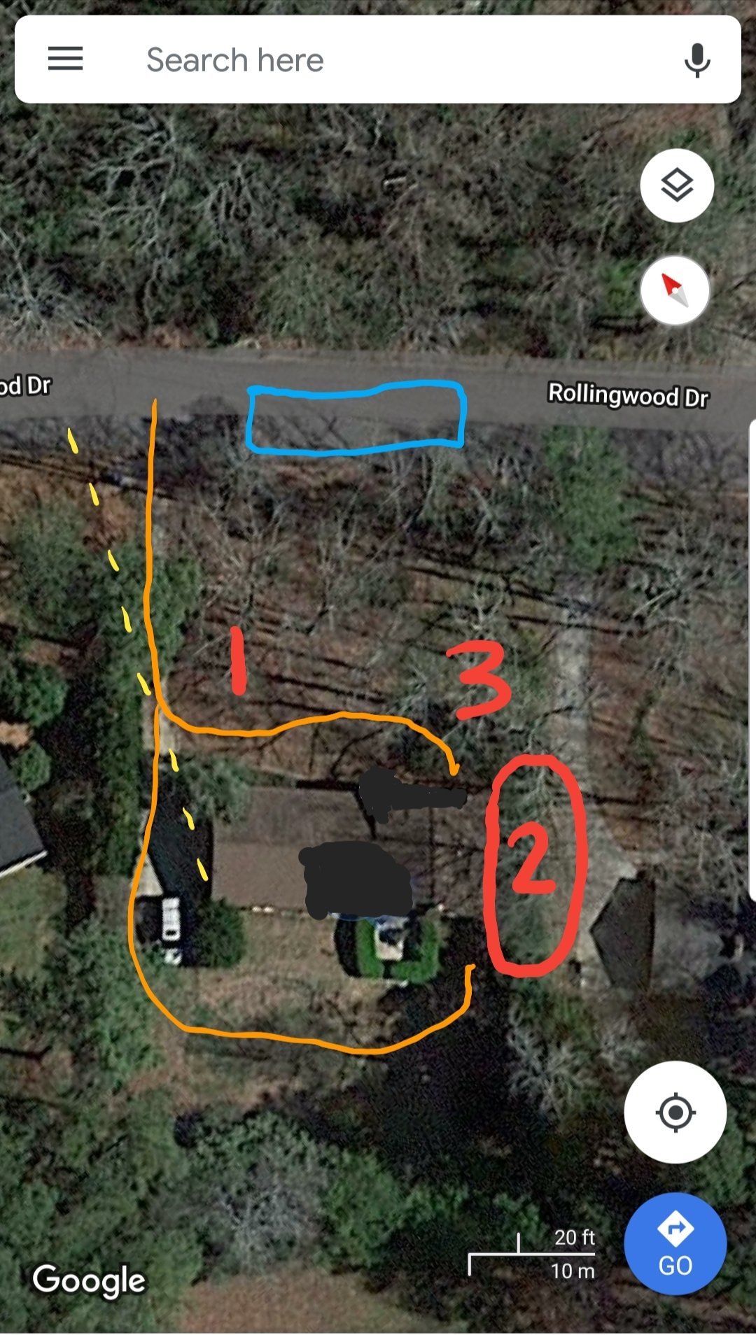 Aerial view of a backyard with handwritten markings and numbered sections, including a blue rectangle at the top, orange lines outlining areas, and red numbers 1, 2, and 3, with trees and structures visible.