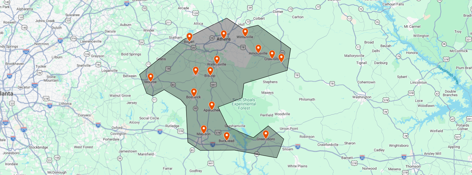 Map of an area in Georgia showing a highlighted region with multiple orange location markers, including cities such as Athens, Monroe, Watkinsville, Bishop, Bostwick, Atlanta, and Buckhead, with surrounding roads and geographical features.
