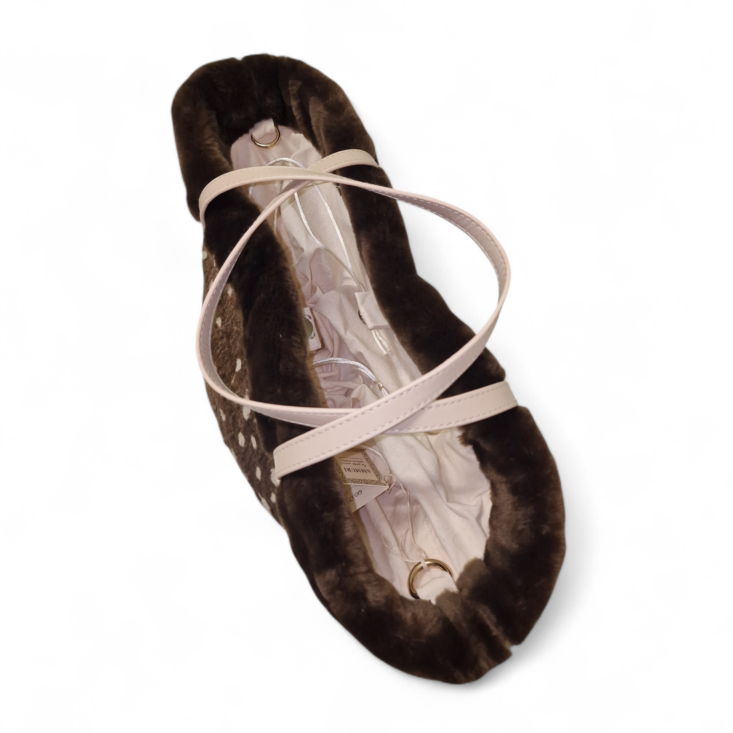 vista dall'alto della borsa con interno rivestito in cotone e chiusura con bottoncino magnetico dorato