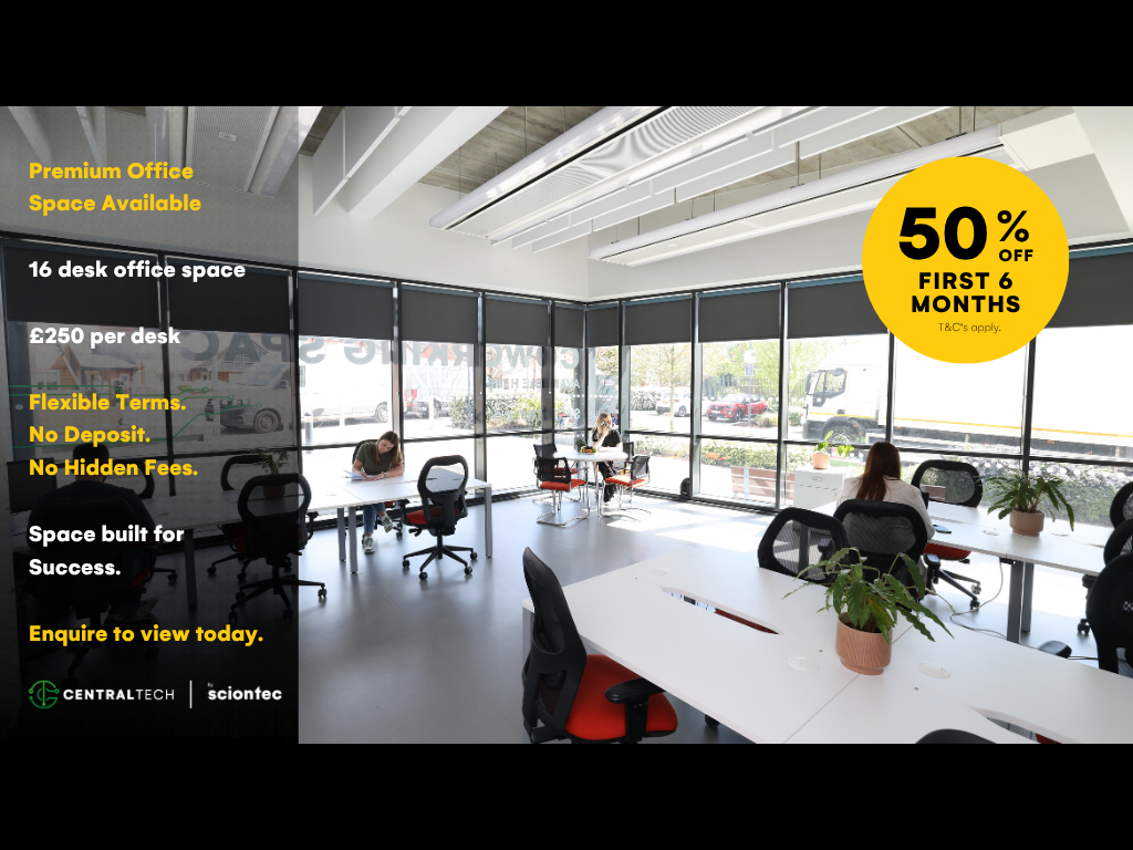 Empty conference room with white tables, black chairs with red cushions, large windows, and overhead fluorescent lighting.
