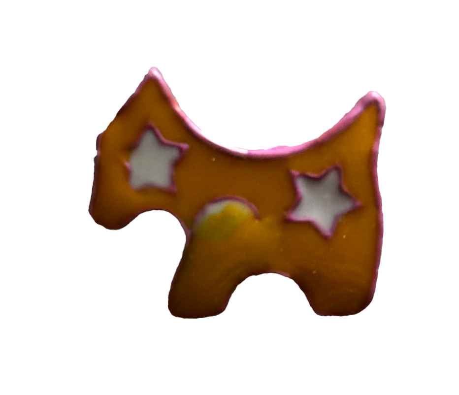 A dog-shaped cookie decorated with pink icing and white star-shaped details.