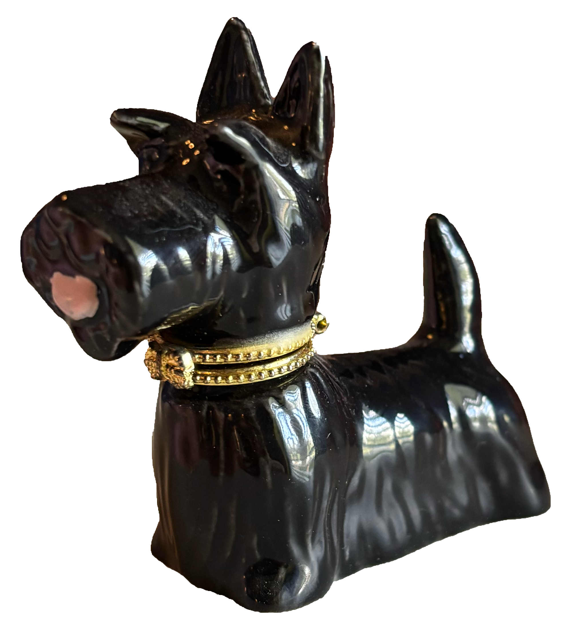 Black dog-shaped figurine with a collar, shiny surface, and detailed features, isolated on a plain background.