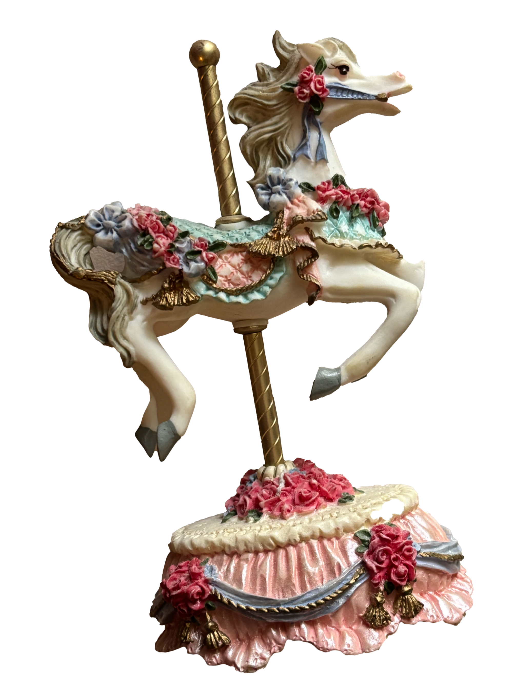 Decorative ceramic carousel horse figurine with pink, blue, and gold accents, featuring floral embellishments and a gold pole, set on a pink and white base with roses and tassels.