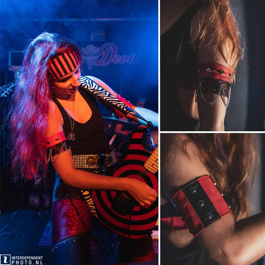 A female rock musician performing on stage with a red and black striped guitar, wearing a striped headband, black tank top, and red accessories. The background shows stage lighting and a sign with the word 'Dead'. Close-up images highlight her red an