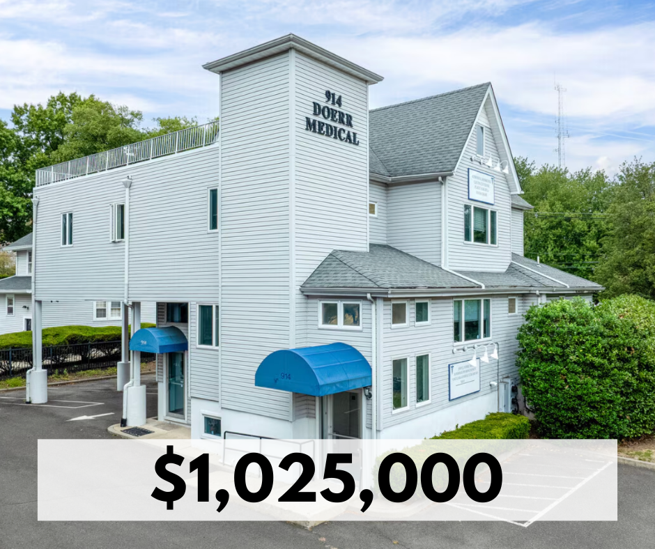 White three-story medical building with blue awnings and sign that reads '914 Doerr Medical.' Parking lot in front and surrounding greenery.