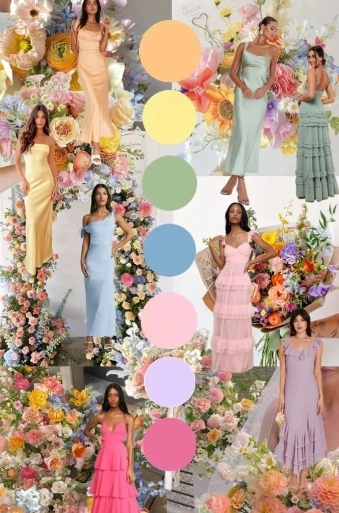 Seven women in pastel-colored dresses posing among large flower arrangements of roses, peonies, and other blooms.