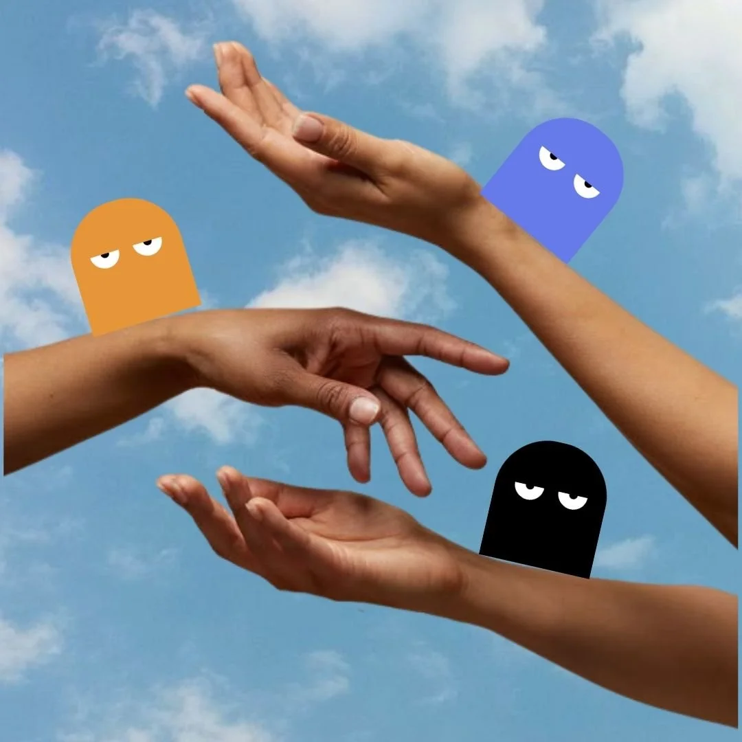 hands of multiple races in front of sky with Our Kind Therapy cartoon logo figures on each arm
