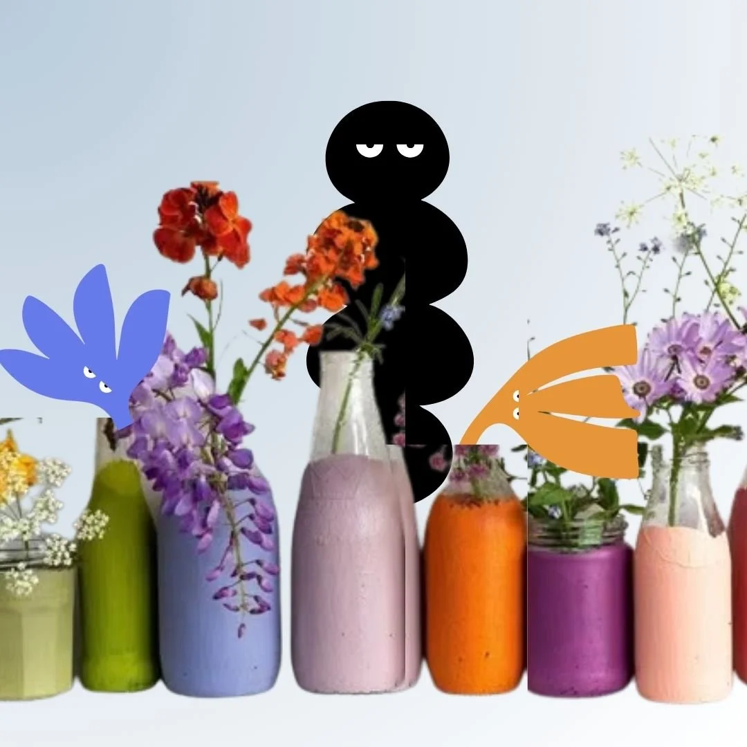 colourful smoothies in individual bottles with flowers coming out and Our Kind Therapy cartoon logo figure in the background