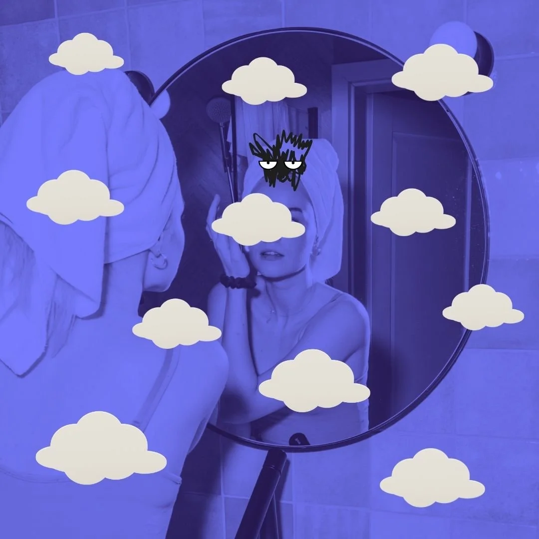 Woman looking at her reflection in bathroom mirror with Our Kind Therapy cartoon logo figure looking back and clouds overlay 