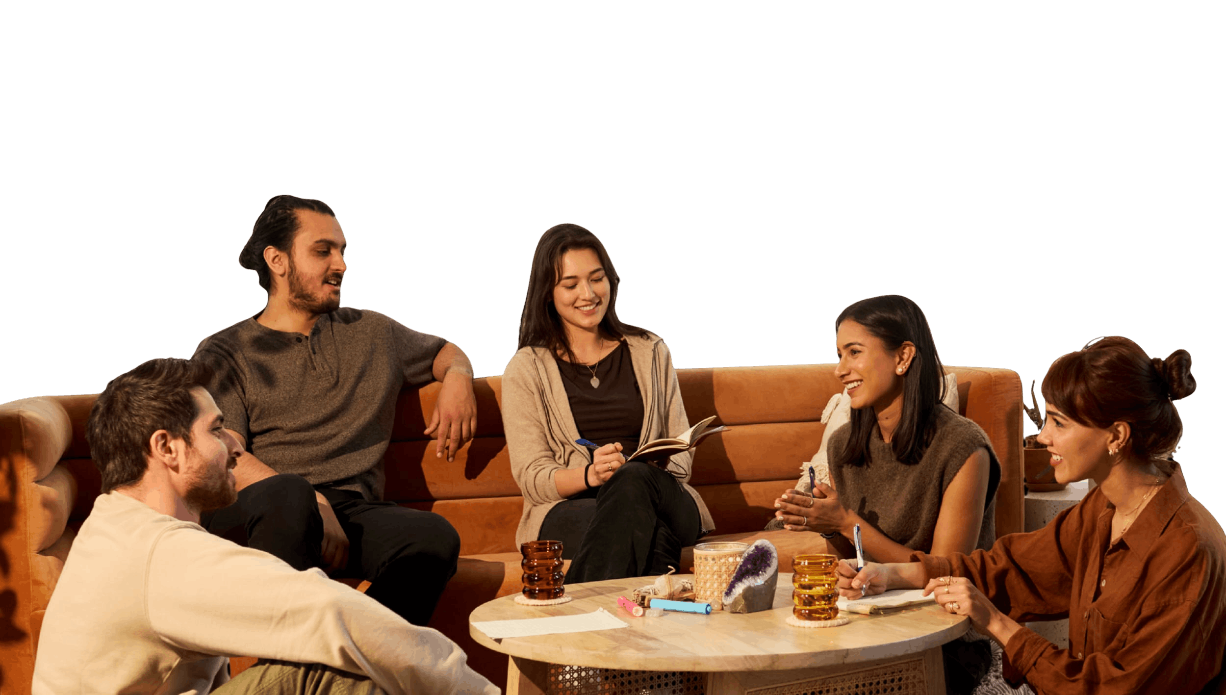 Group of Friends sitting in a circle. Some are sitting on the floor and some on the couch.