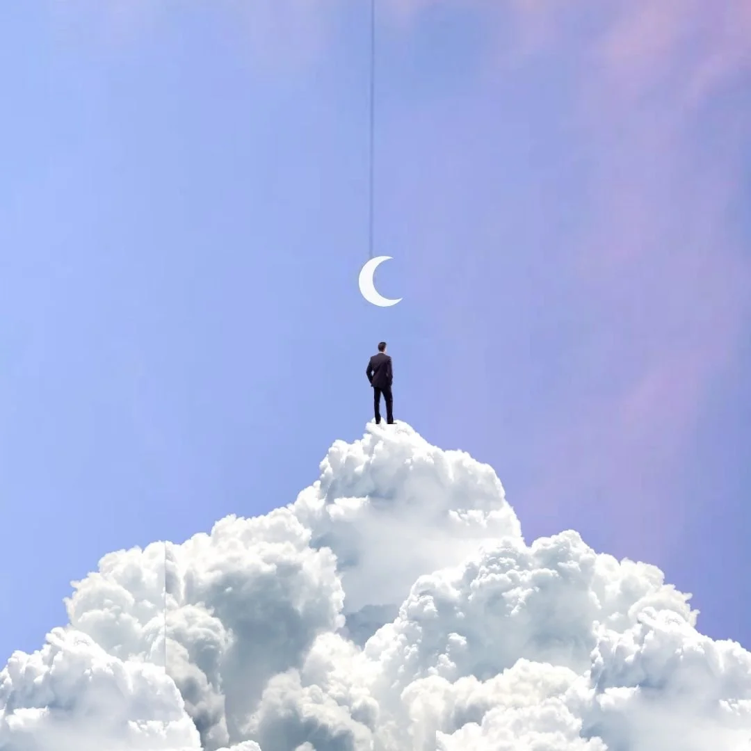 Person standing on top of clouds next to moon crescent 