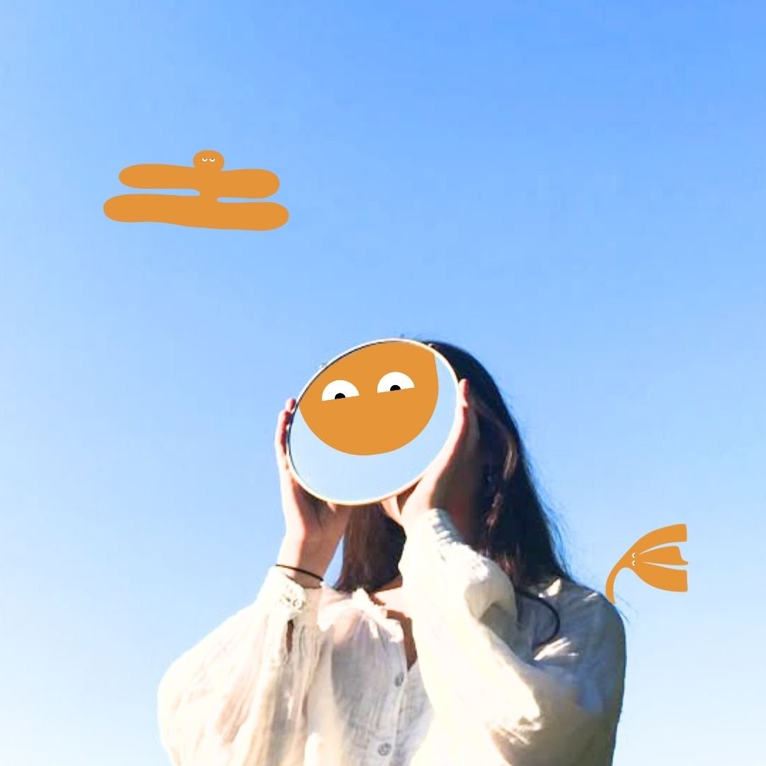 person covering face with mirror with Our Kind Therapy cartoon logo figures around