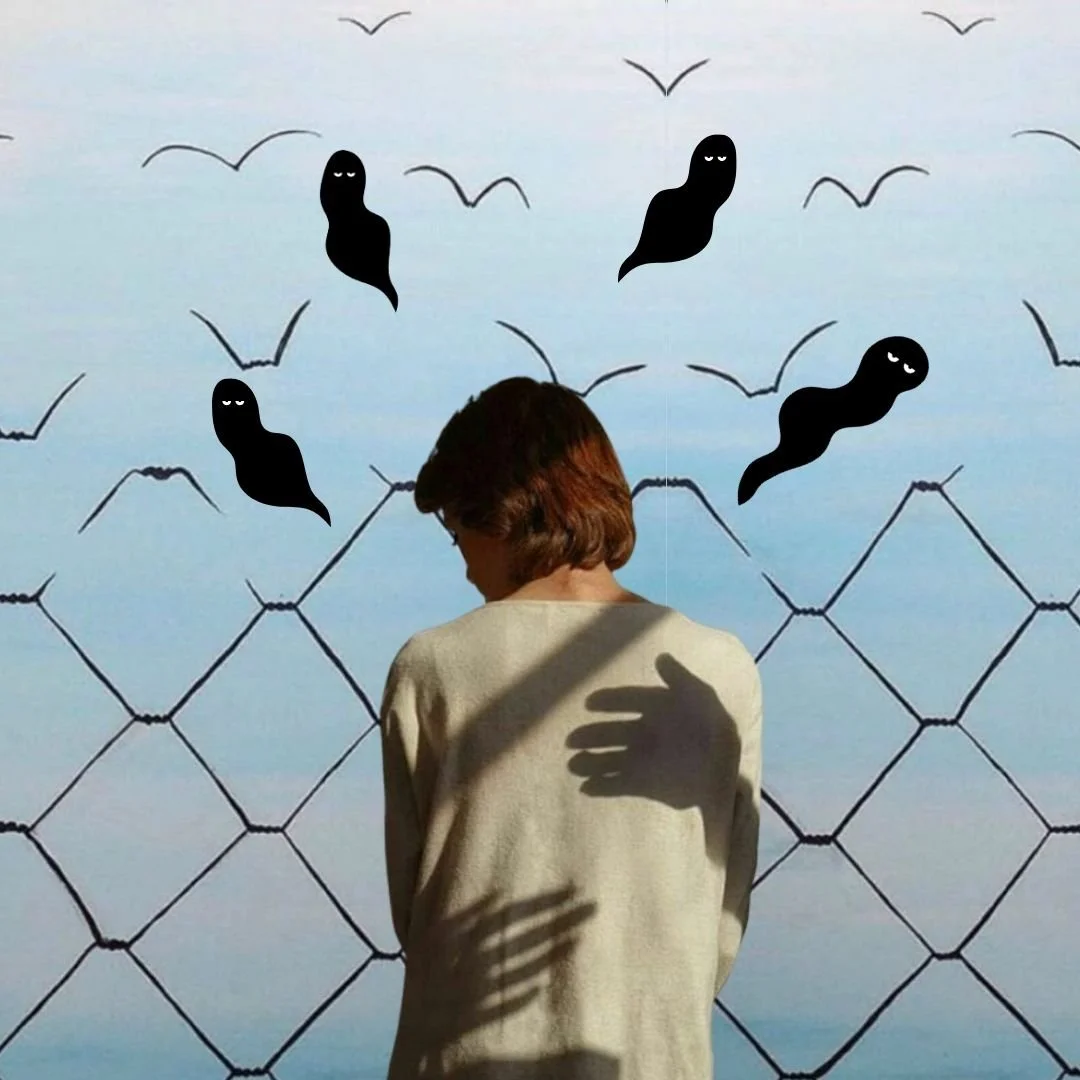 person with back showing and shadow hands giving them a hug with Our Kind Therapy cartoon logo figures flying around