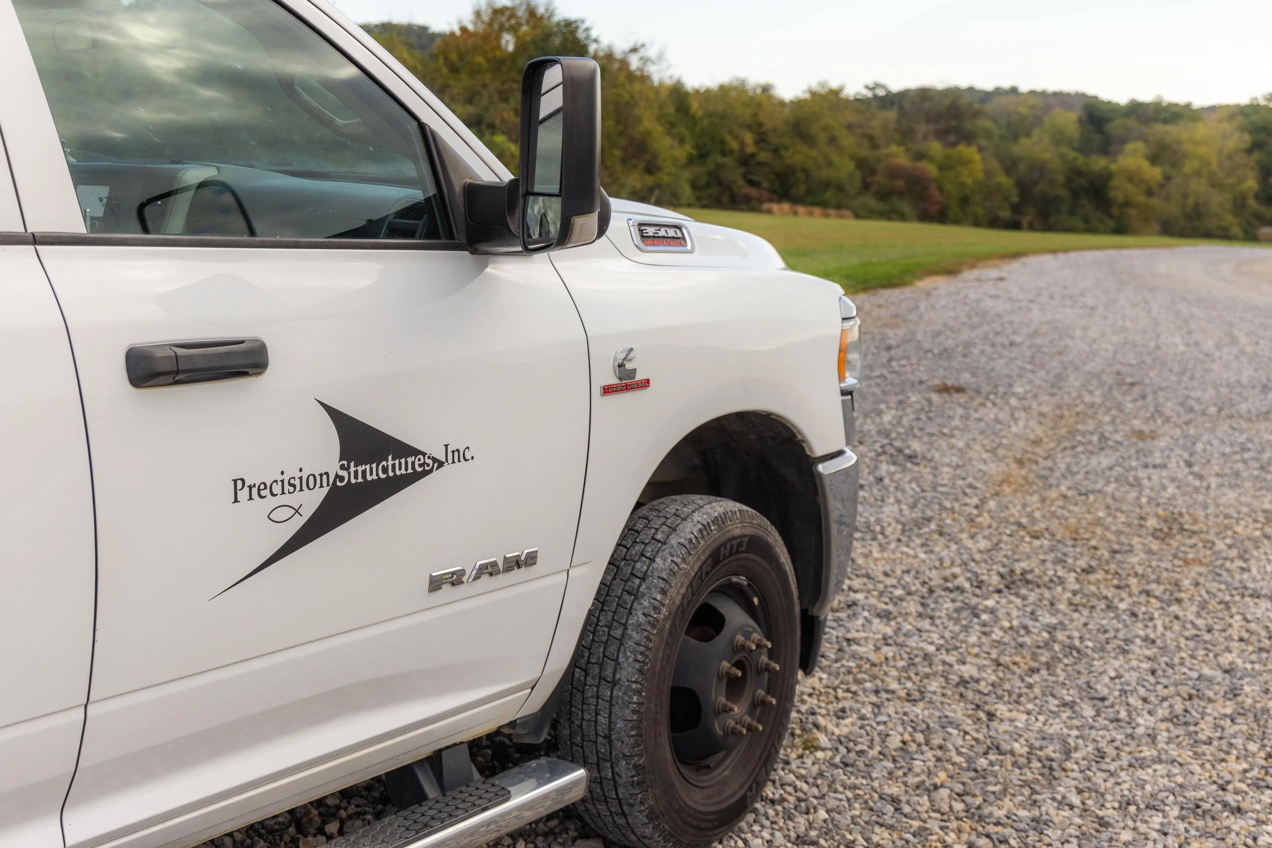 Precision Structures, Inc. white truck