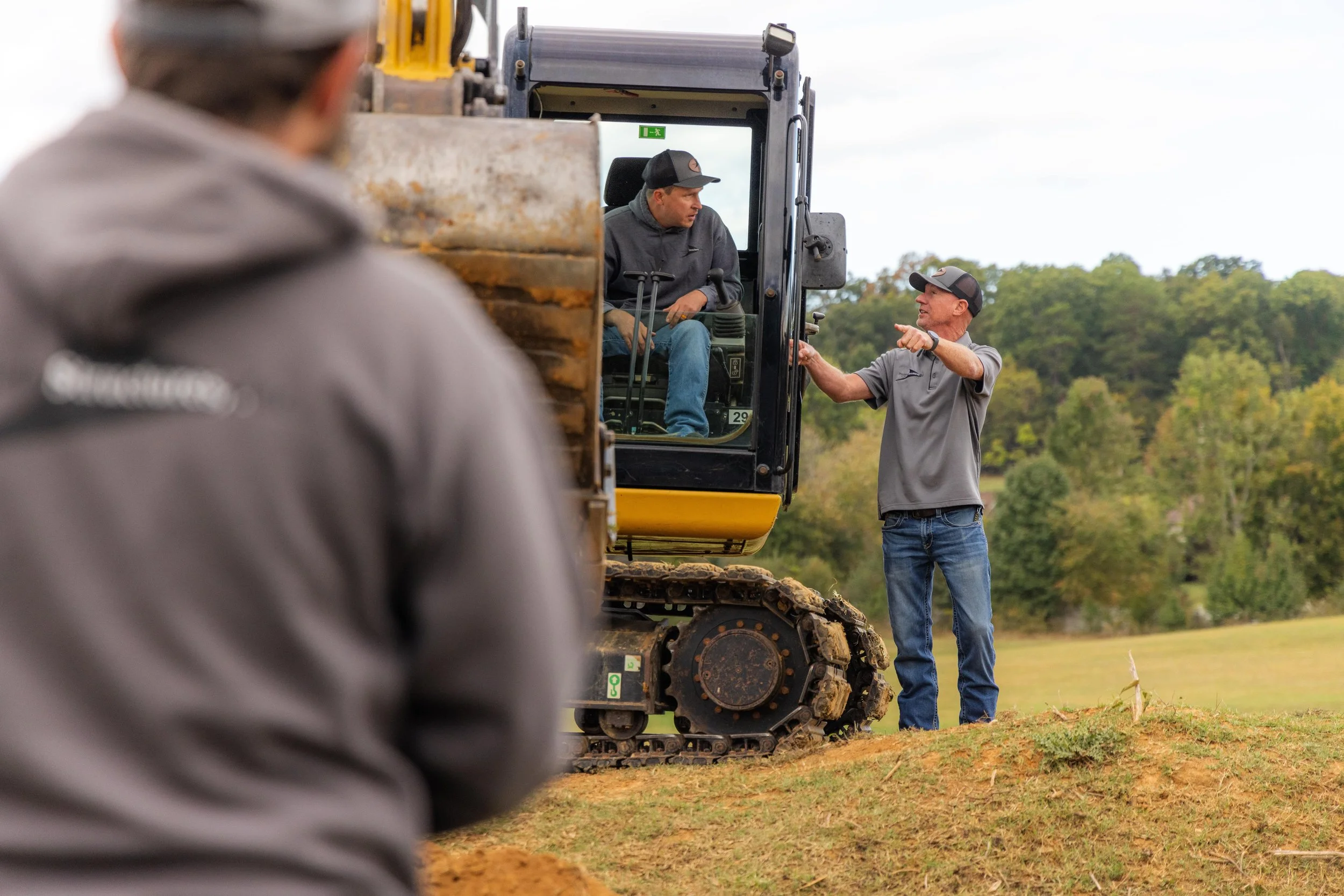 The Precision Structures, Inc. dirt team working on a landing clearing project in East Tennessee.