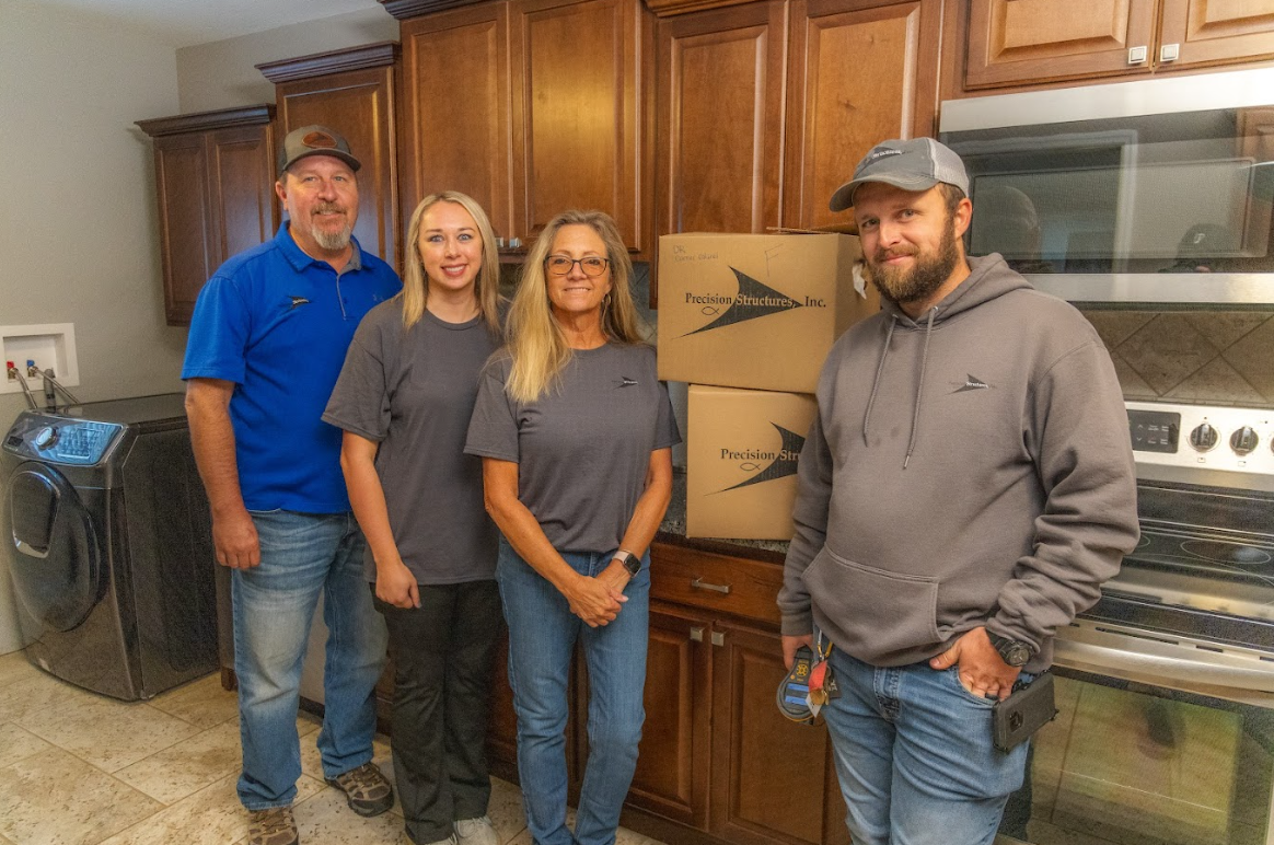 Water Damage Restoration team from Precision Structures, Inc.