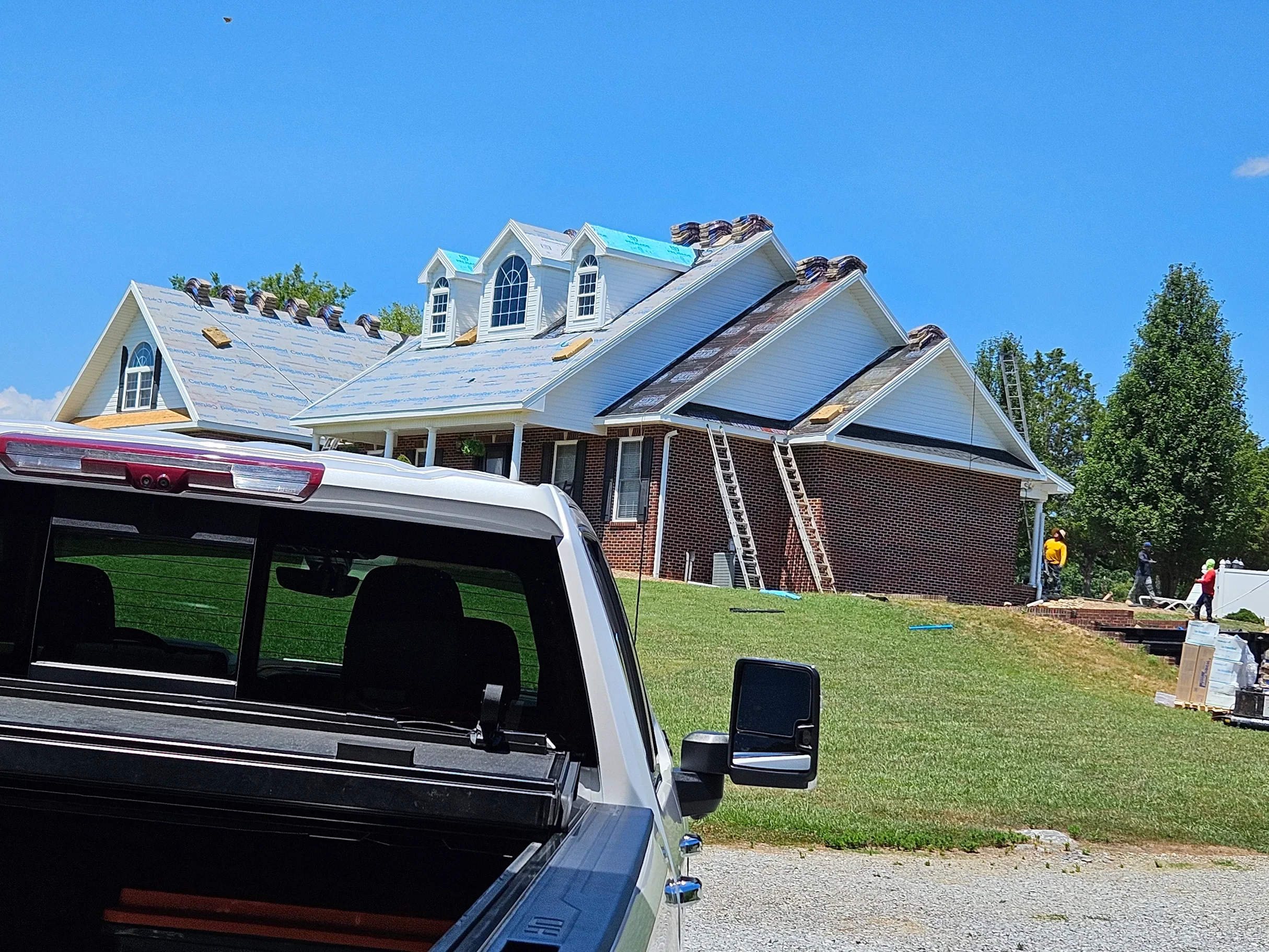 Precision Structures, Inc. team working on a roof restoration project.