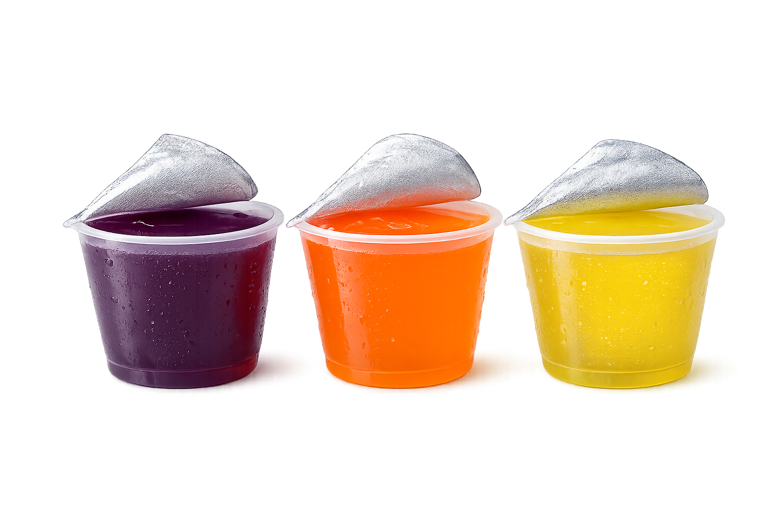Three cups of colorful jelly snack with foil lids partially peeled back, arranged in purple, orange, and yellow colors.