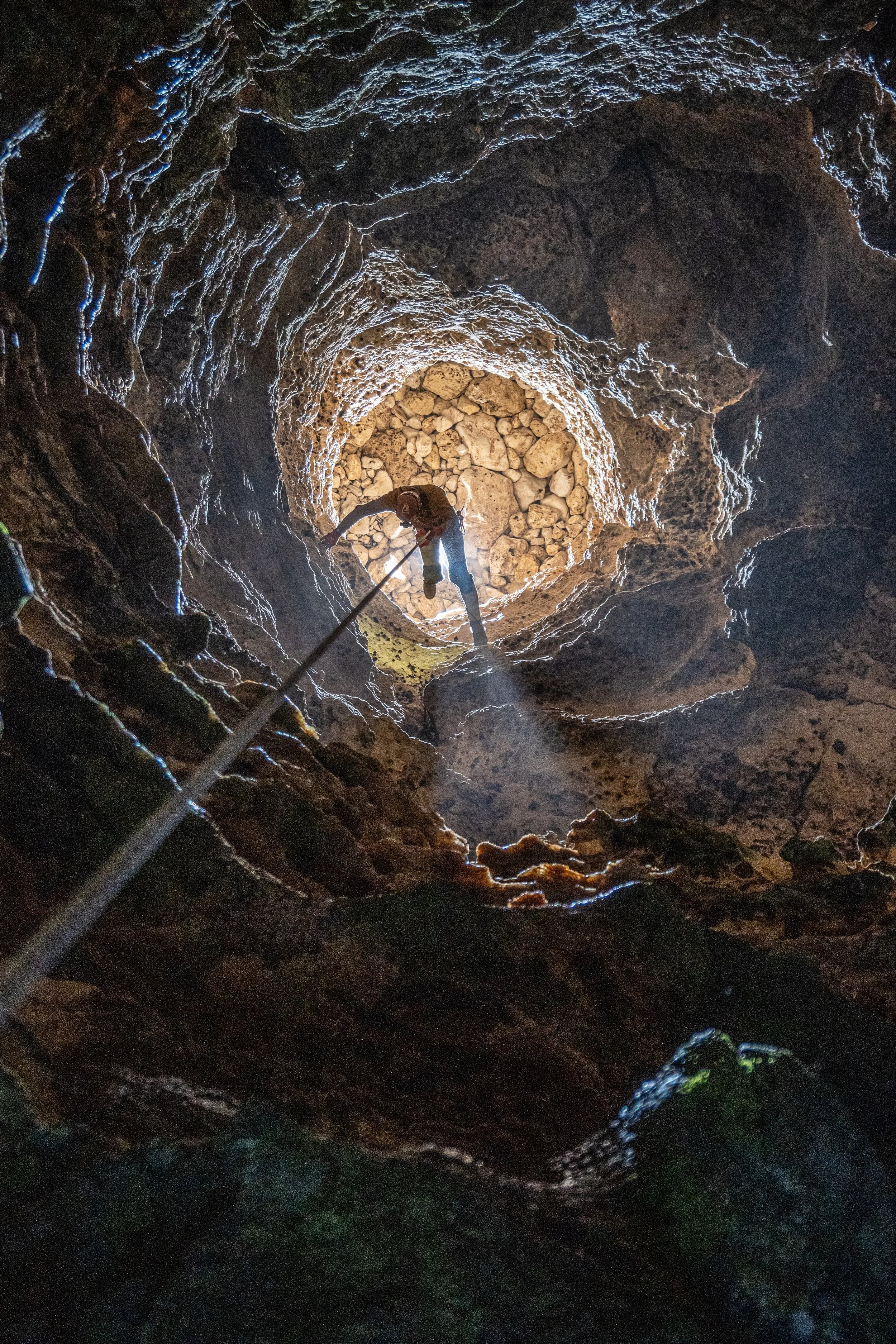 Descending into a cave to conduct biological monitoring