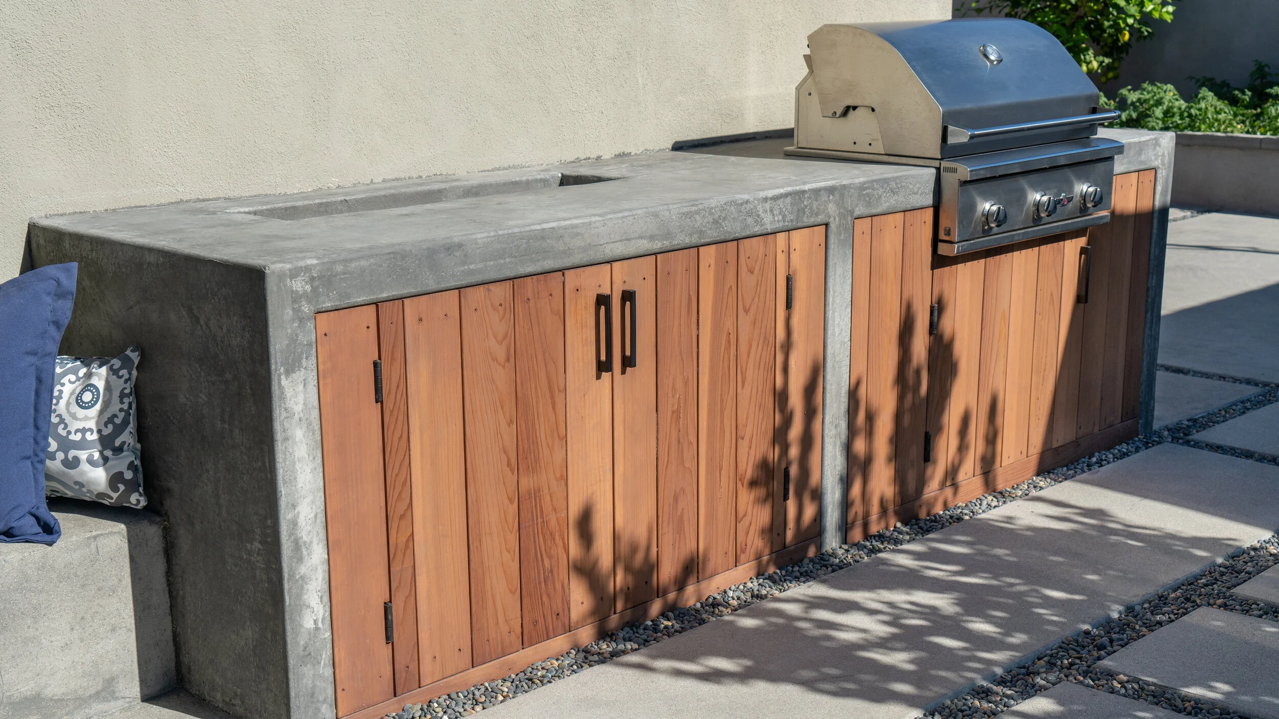 Modern Studio City backyard with steel shade structure and built-in BBQ