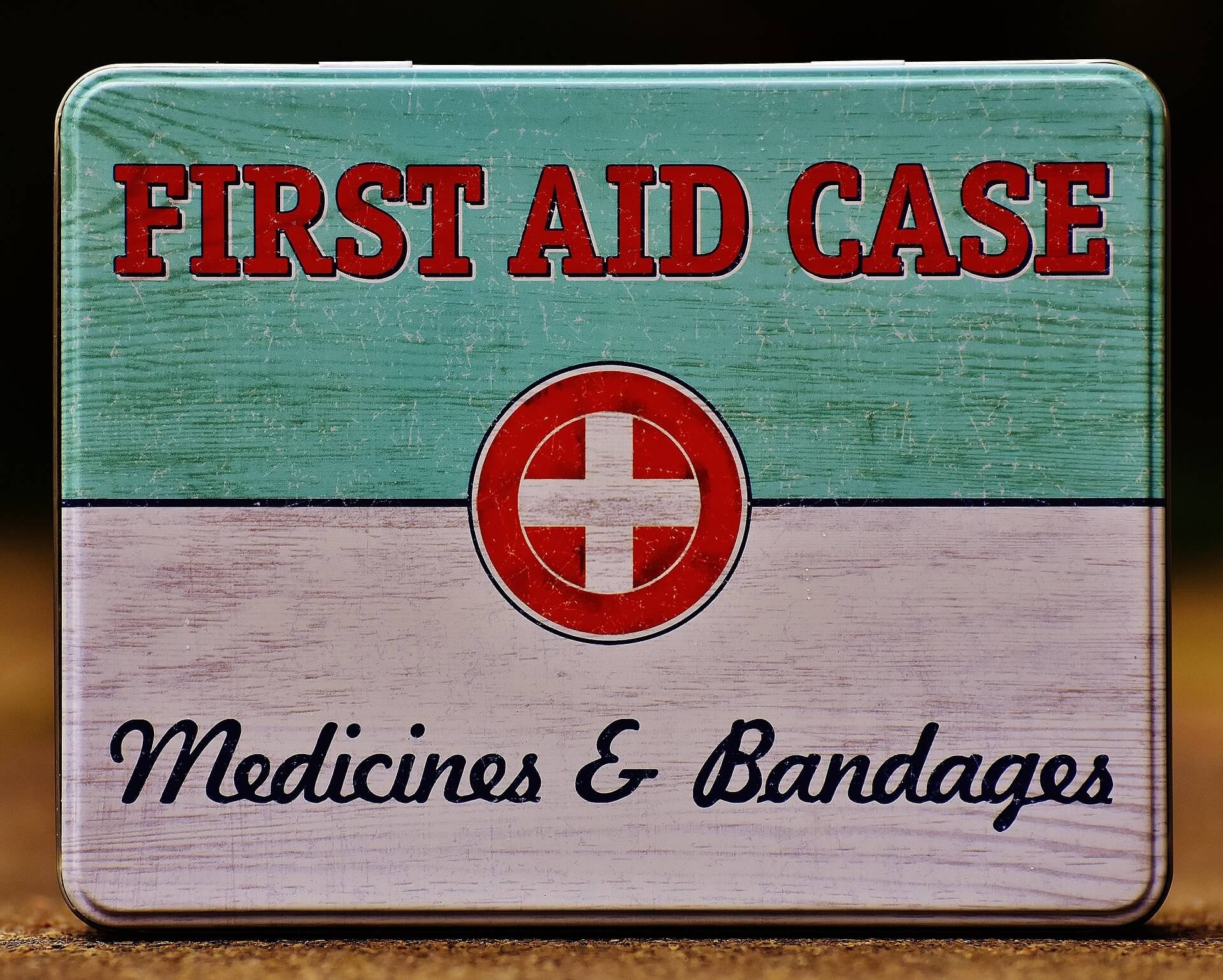 A first aid kit box with text reading 'First Aid Case' and a red cross symbol. Below, it says 'Medics & Bandages'.