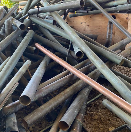 This image displays scrap metal in a pile that has been bought by Hubbard Brothers.