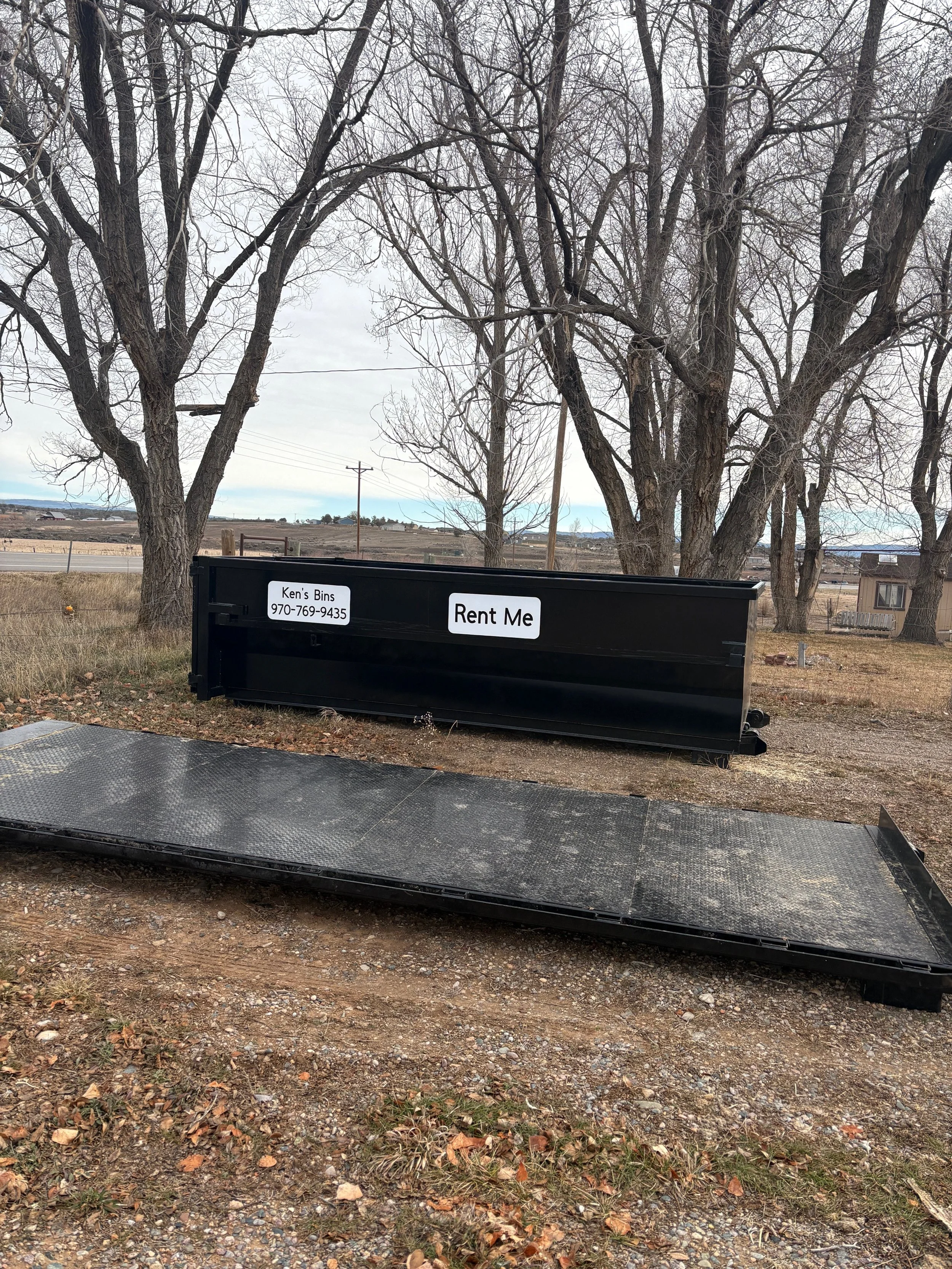 Flatbed and 13 cubic yard roll-offs