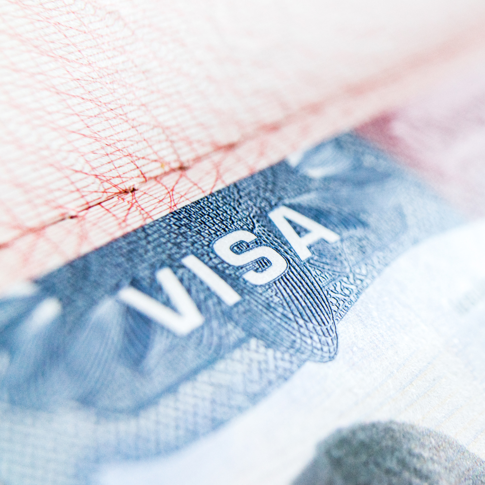 Close-up of a United States passport showing the word "USA" on the cover.