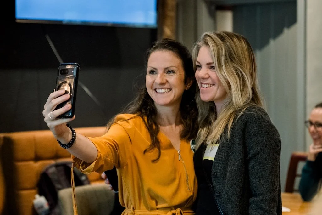 Two Women Inspired Network leaders smiling and taking a selfie